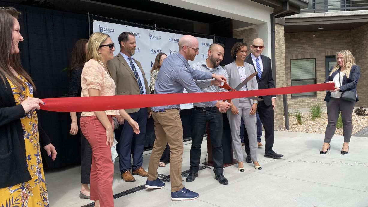 State Sen. Derek Kitchen, D-Salt Lake City, participates in the ribbon-cutting at the site of the new affordable housing apartment project, Capitol Homes Apartments, in Salt Lake City on Wednesday.