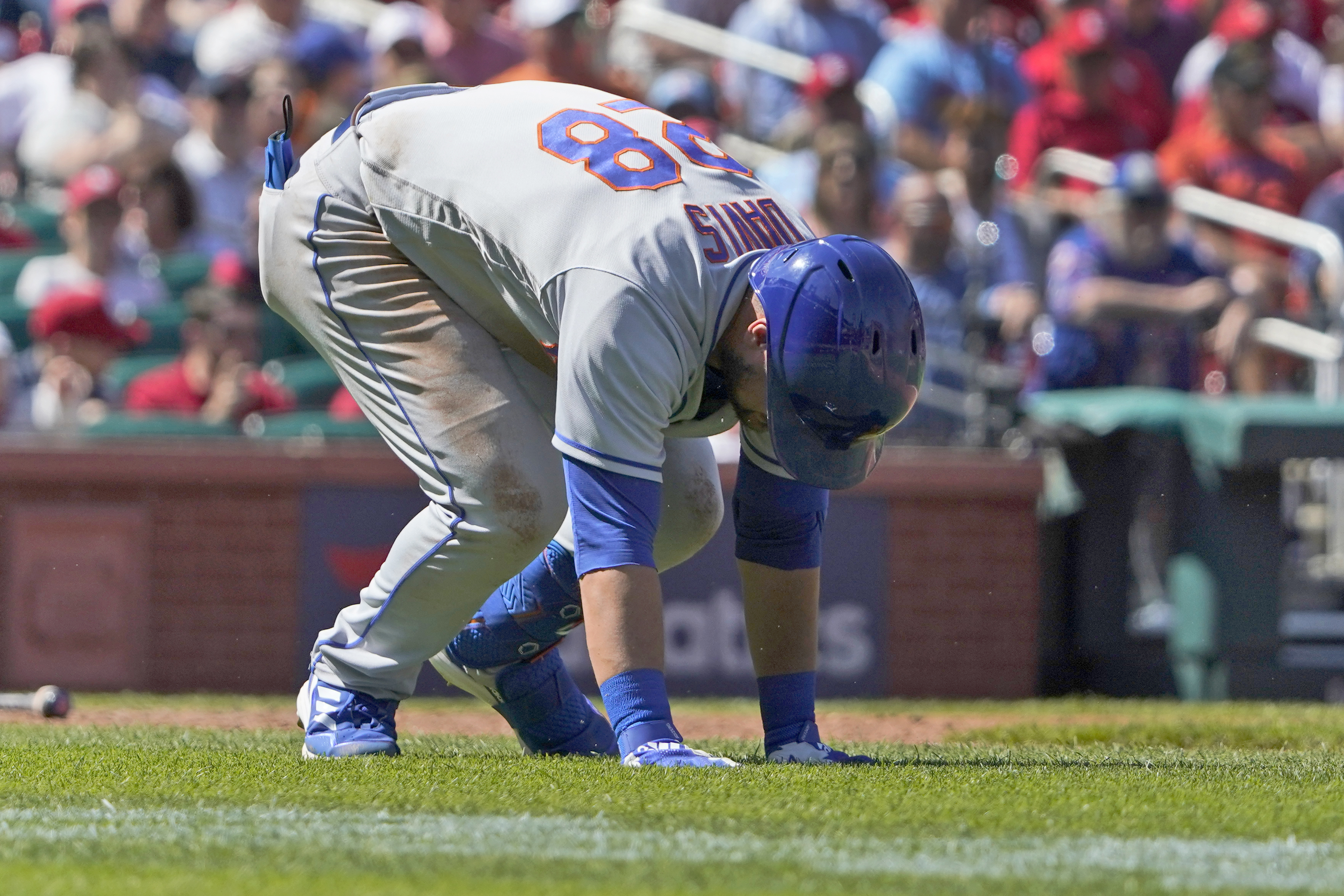 New York Mets' J.D. Davis doubles over after being hit by a pitch during the eighth inning of a baseball game against the St. Louis Cardinals Wednesday, April 27, 2022, in St. Louis. Davis left the game. 