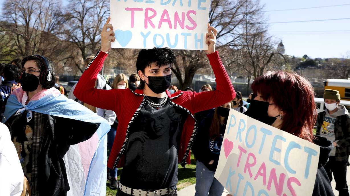 West High School students Eli Cutler and Kaitlin Jensen protest the Utah Legislature’s passage of HB11, which bans transgender girls from participating in female school sports, in Salt Lake City on April 6.