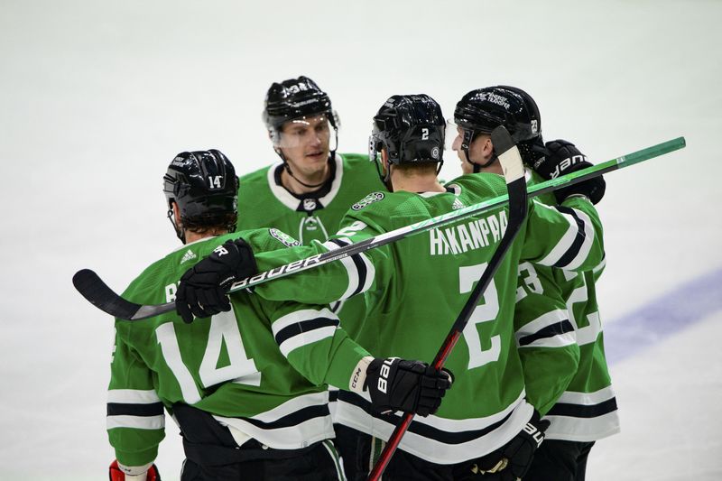 Apr 27, 2022; Dallas, Texas, USA; Dallas Stars left wing Jamie Benn (14) and right wing Denis Gurianov (34) and defenseman Jani Hakanpaa (2) and defenseman Esa Lindell (23) celebrates a goal scored by Hakanpaa against the Arizona Coyotes during the first period at the American Airlines Center.