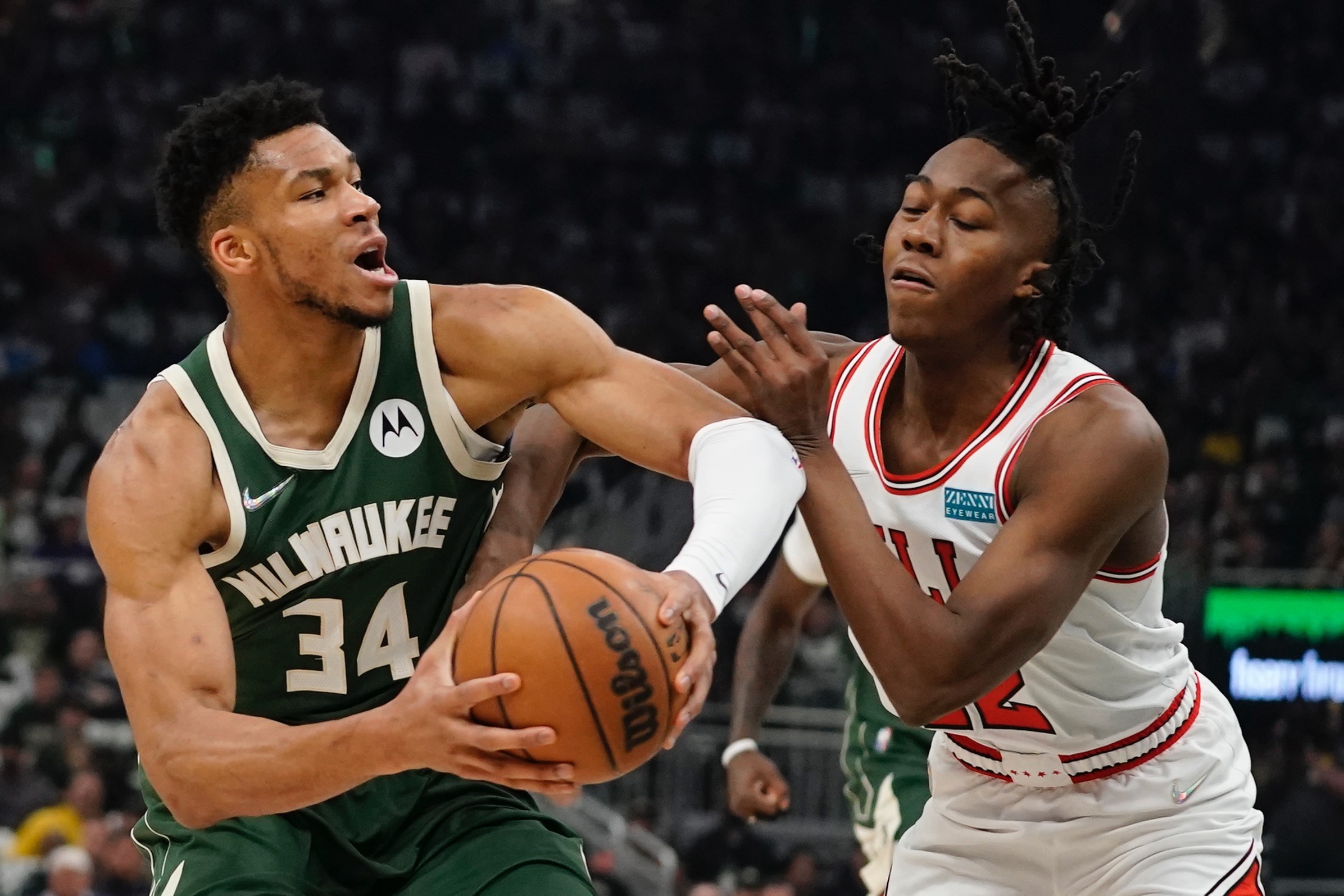 Milwaukee Bucks' Giannis Antetokounmpo gets past Chicago Bulls' Ayo Dosunmu during the first half of Game 5 of their NBA playoff basketball game Wednesday, April 27, 2022, in Milwaukee. 
