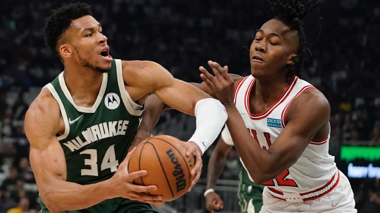 Milwaukee Bucks' Giannis Antetokounmpo gets past Chicago Bulls' Ayo Dosunmu during the first half of Game 5 of their NBA playoff basketball game Wednesday, April 27, 2022, in Milwaukee.