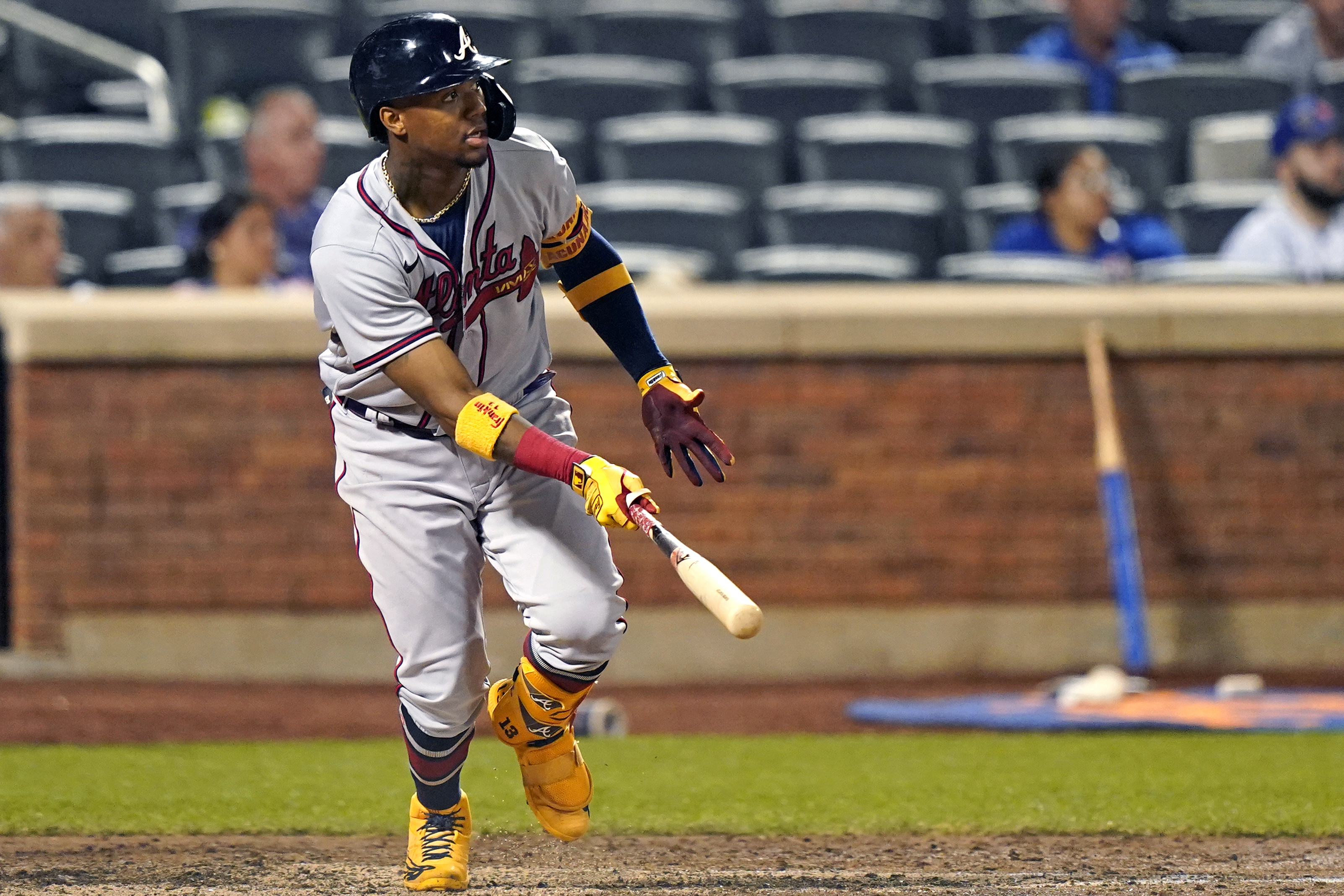 FILE - Atlanta Braves' Ronald Acuña Jr. watches his fifth-inning, solo home run off New York Mets relief pitcher Miguel Castro (50) in the second baseball game of a doubleheader, Monday, June 21, 2021, in New York. Acuña Jr. will begin a rehab assignment with Triple-A Gwinnett on Tuesday, April 19, 2022, as he nears a return from the torn right ACL that ended his 2021 season. 