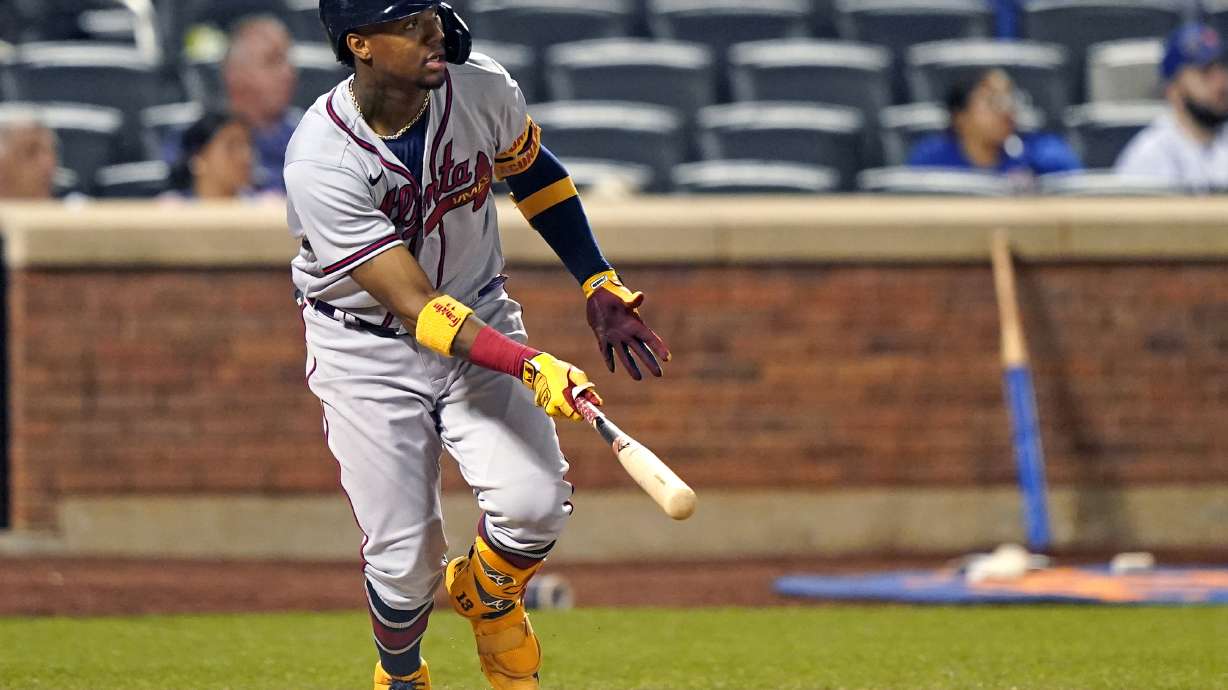 FILE - Atlanta Braves' Ronald Acuña Jr. watches his fifth-inning, solo home run off New York Mets relief pitcher Miguel Castro (50) in the second baseball game of a doubleheader, Monday, June 21, 2021, in New York. Acuña Jr. will begin a rehab assignment with Triple-A Gwinnett on Tuesday, April 19, 2022, as he nears a return from the torn right ACL that ended his 2021 season.
