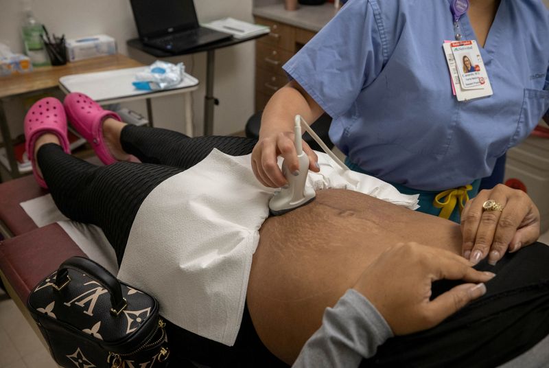 A doctor does an ultrasound on a patient from Austin, Texas, before her surgical abortion at Trust Women clinic in Oklahoma City on Dec. 6. Oklahoma lawmakers on Thursday passed a bill that would ban abortions after six weeks of pregnancy.