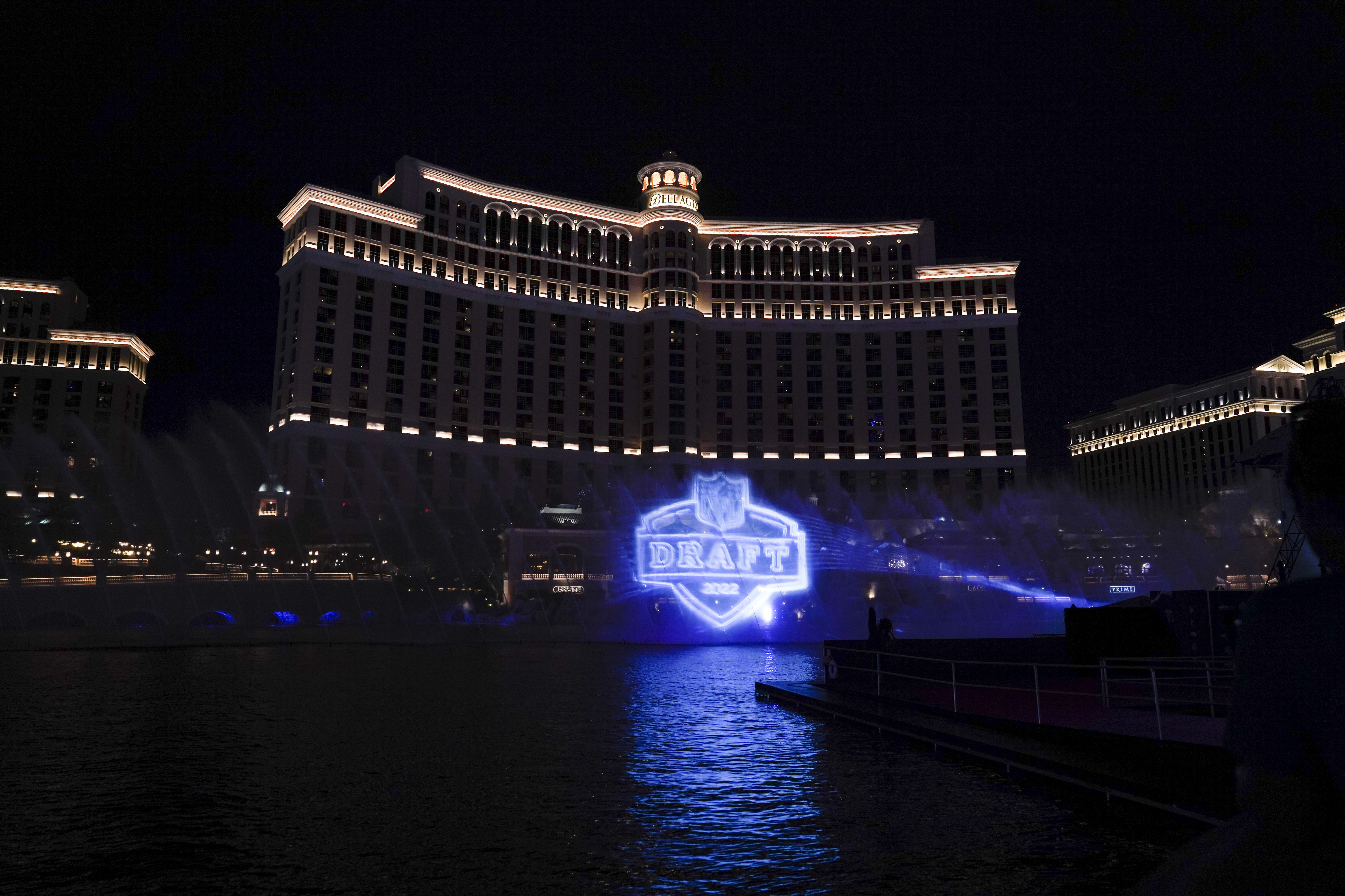 A logo of the 2022 NFL football draft is projected at the Fountains of Bellagio on Wednesday, April 27, 2022, in Las Vegas, the day before the draft. 