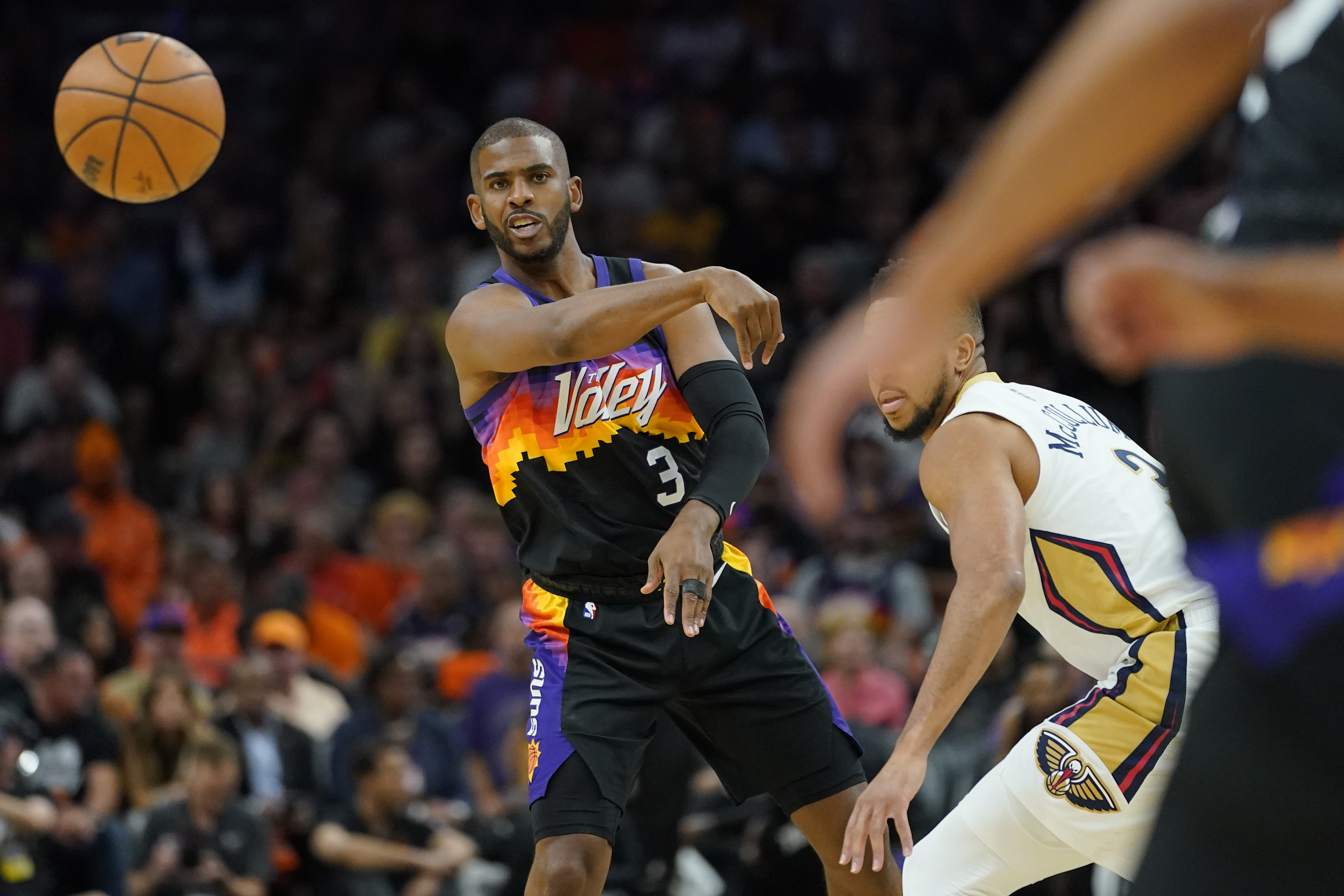 Phoenix Suns guard Chris Paul (3) passes against the New Orleans Pelicans during the first half of Game 5 of an NBA basketball first-round playoff series, Tuesday, April 26, 2022, in Phoenix. 