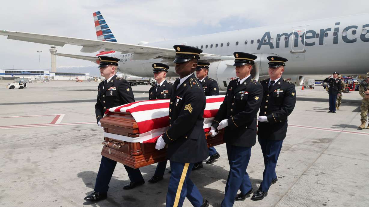 An Honor Guard made up of members of the Utah National Guard conduct an Honorable Carry at the Salt Lake City International Airport on Tuesday. After being missing in action for 71 years, U.S. Army Cpl. David Milano's remains were returned to U.S. soil on Tuesday and will be buried next to his family at Evergreen Memorial Park in Ogden.