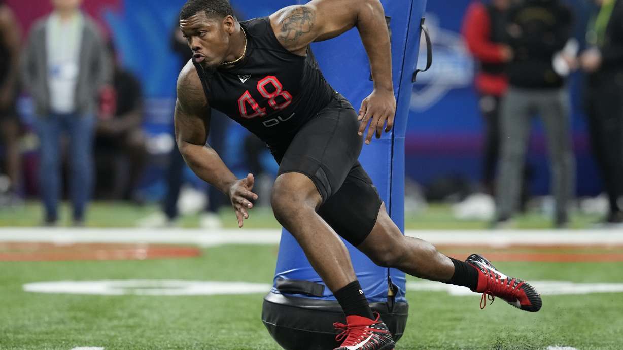 FILE - Georgia defensive lineman Travon Walker runs a drill during the NFL football scouting combine, Saturday, March 5, 2022, in Indianapolis. Walker is expected to be taken in the NFL Draft.