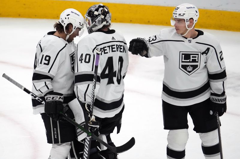 FILE PHOTO: Feb 23, 2022; Glendale, Arizona, USA; Los Angeles Kings left wing Alex Iafallo (19) and Los Angeles Kings goaltender Cal Petersen (40) and Los Angeles Kings right wing Dustin Brown (23) celebrate after the third period against the Arizona Coyotes at Gila River Arena.