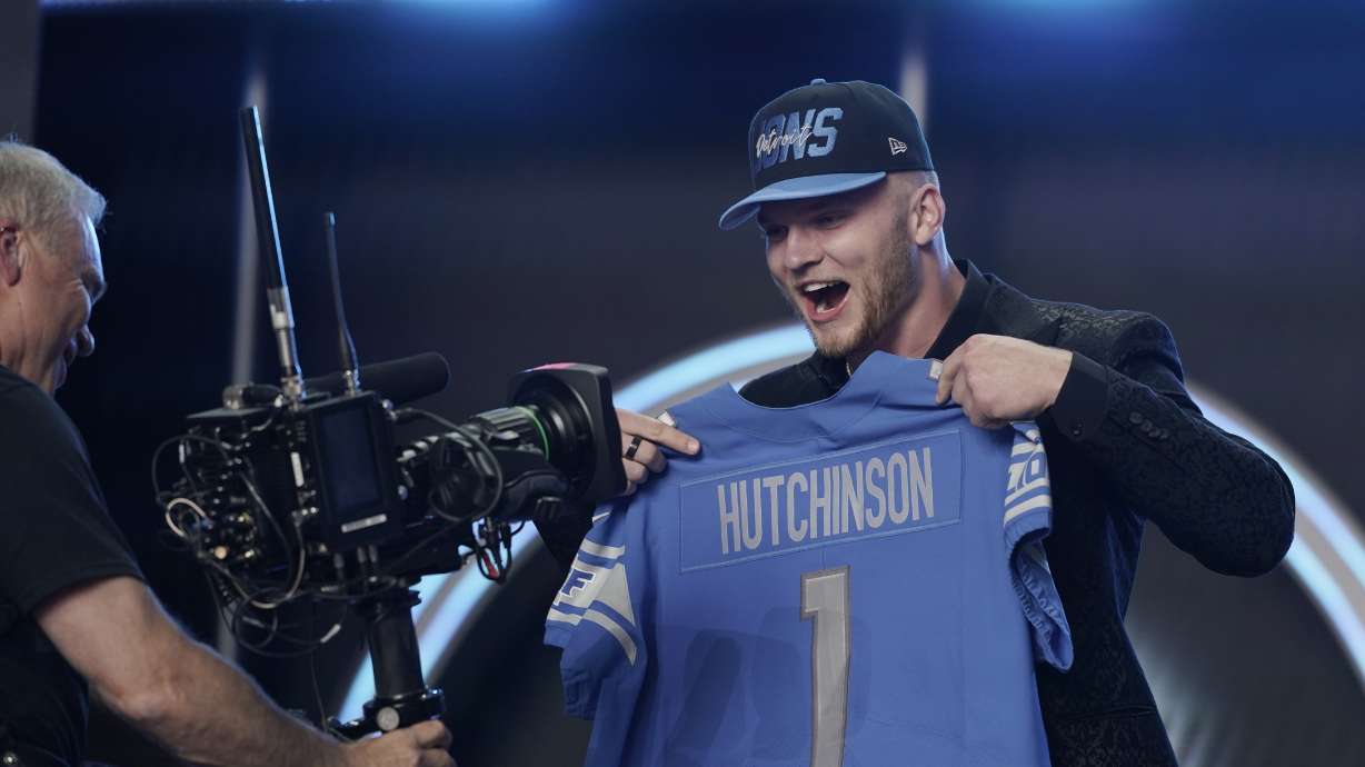 Michigan defensive end Aidan Hutchinson celebrates being selected by the Detroit Lions as the second pick in the NFL football draft Thursday, April 28, 2022, in Las Vegas.