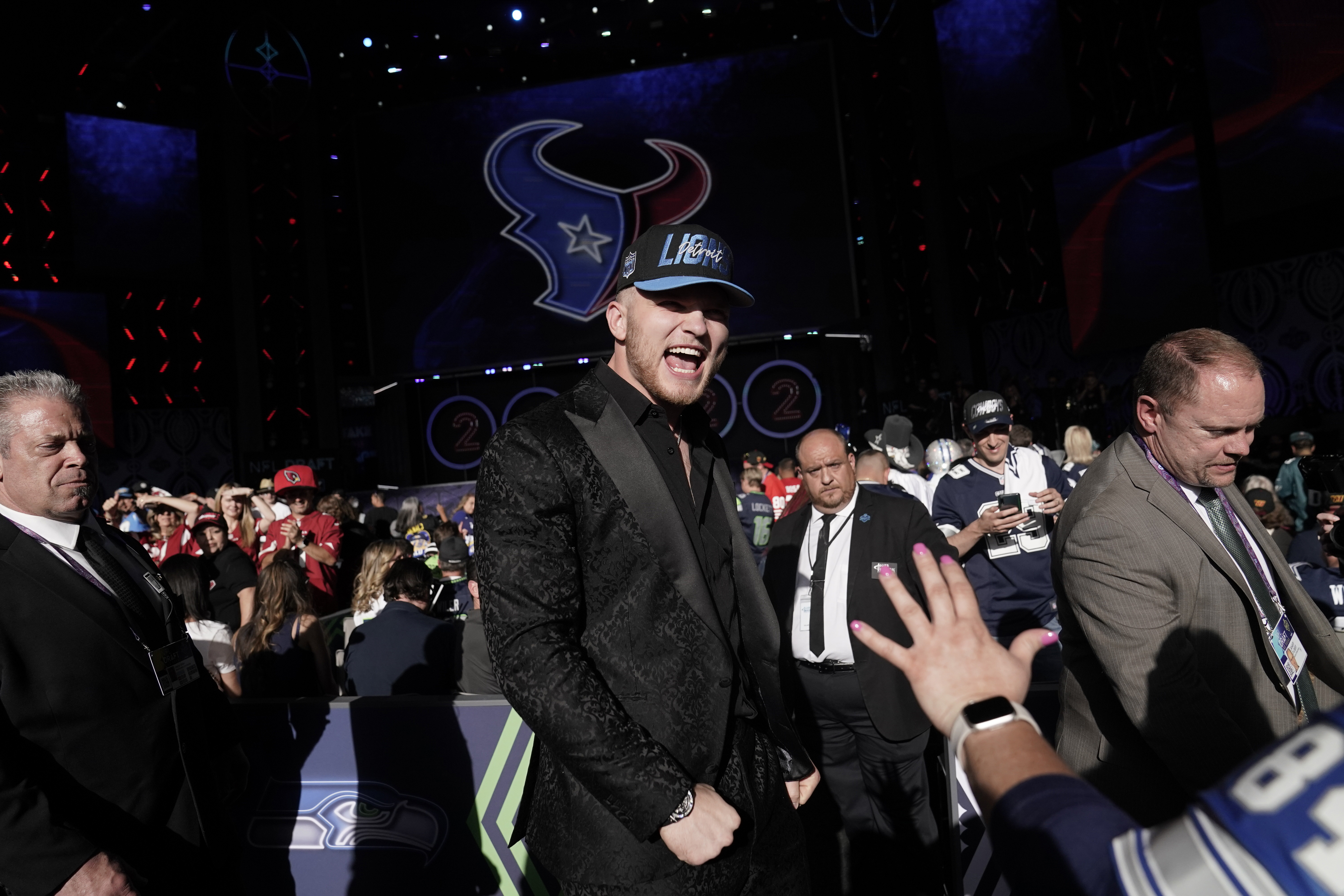 Michigan defensive end Aidan Hutchinson celebrates after being selected by the Detroit Lions as the second pick in the NFL football draft Thursday, April 28, 2022, in Las Vegas.