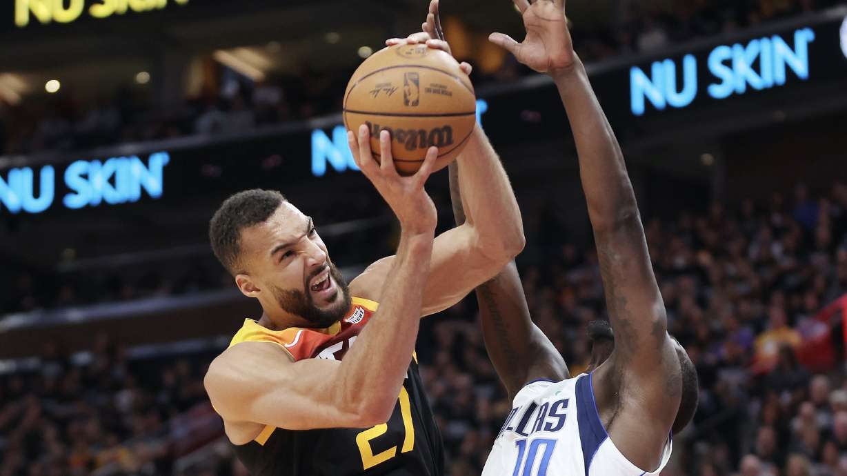 Utah Jazz center Rudy Gobert (27) tries to shoot over Dallas Mavericks forward Dorian Finney-Smith (10) during game 6 of the playoffs in Salt Lake City on Thursday, April 28, 2022.