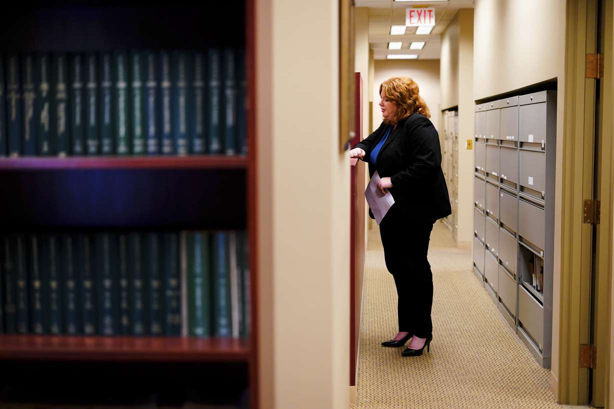 Attorney Robin Frank speaks with a paralegal at their office in Pittsburgh, March 17. Frank, a family law attorney in Pittsburgh, is still trying to untangle how, exactly, Allegheny County’s algorithm is impacting each client she shepherds through the system.
