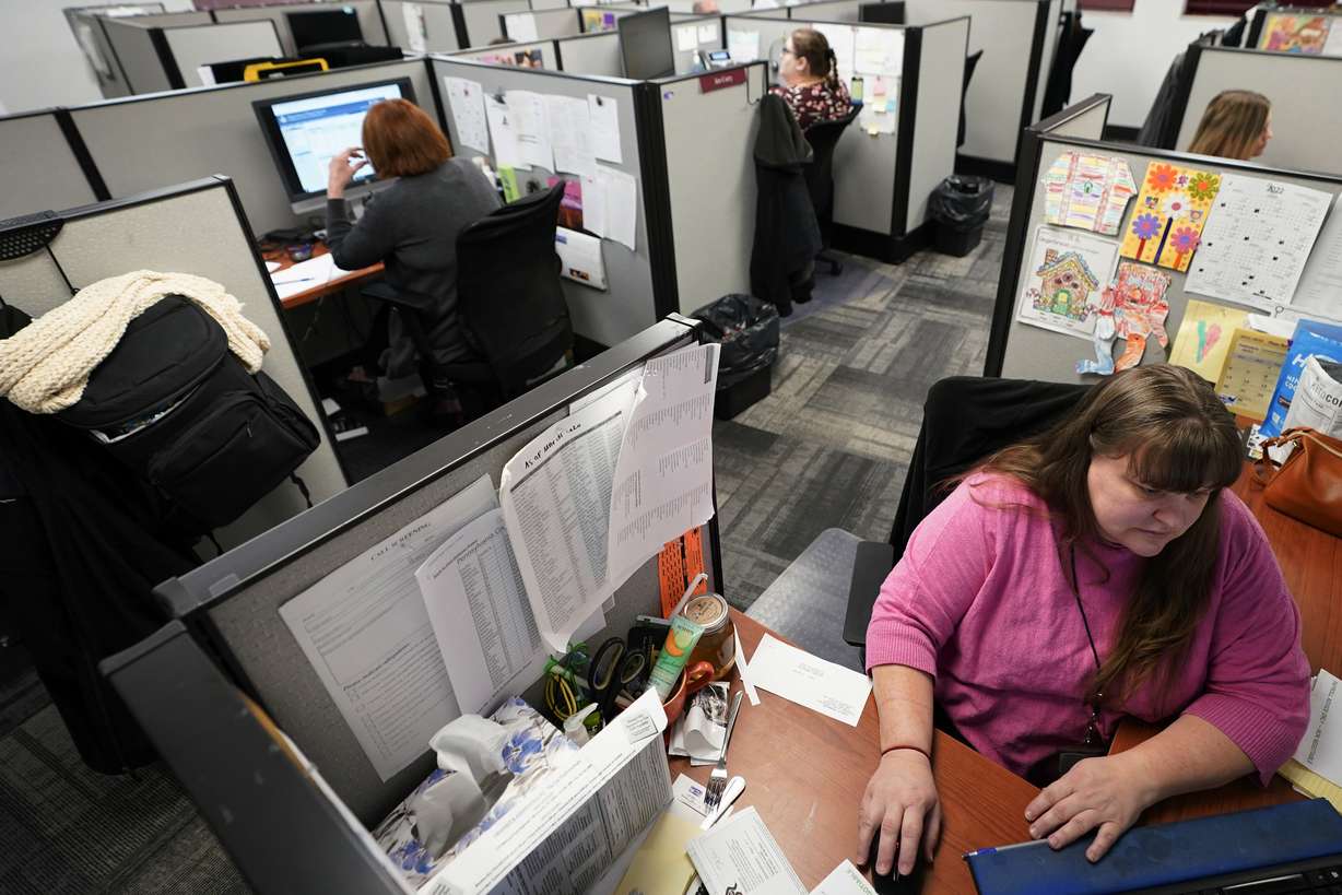 Workers field calls at an intake call screening center for the Allegheny County Children and Youth Services office in Penn Hills, Pa. on Feb. 17.