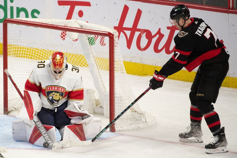 Apr 28, 2022; Ottawa, Ontario, CAN; Florida Panthers goalie Spencer Knight (30) makes a save on a shot from Ottawa Senators left wing Brady Tkachuk (7) in the third period at the Canadian Tire Centre.