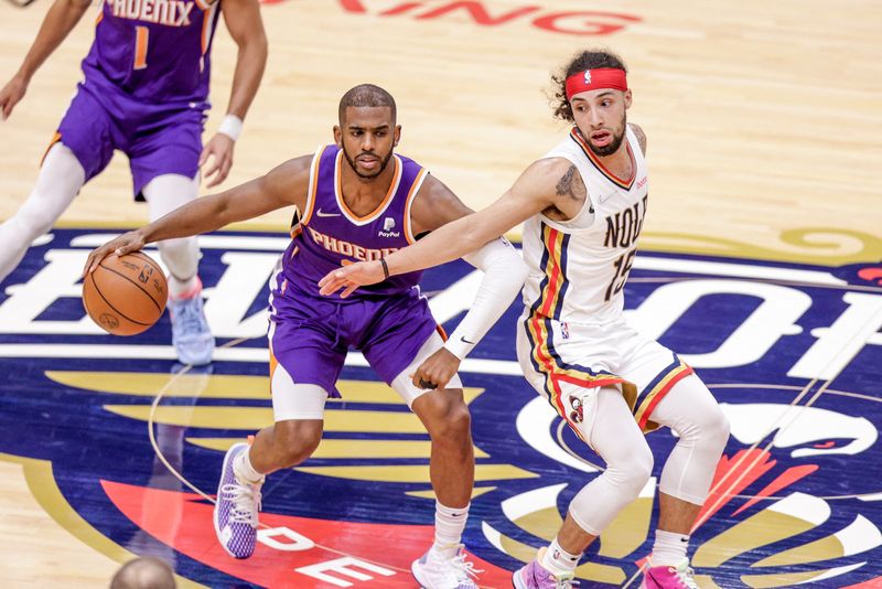 Apr 28, 2022; New Orleans, Louisiana, USA;  New Orleans Pelicans guard Jose Alvarado (15) reaches back for a steal attempt on Phoenix Suns guard Chris Paul (3) during the second half of game six of the first round for the 2022 NBA playoffs at Smoothie King Center.