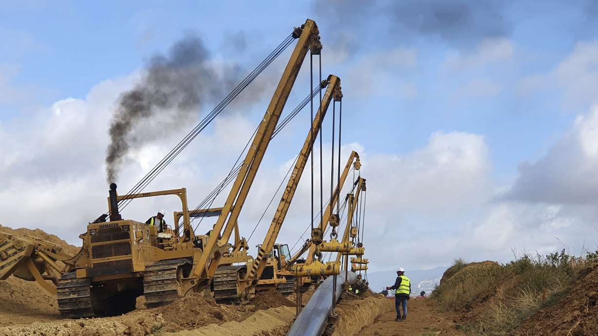 Heavy machines install a pipeline near Komotini town, northern Greece, Sept. 29, 2020. Crossing a remote border area of Greece and Bulgaria, a new pipeline nearing completion will help countries in the region dependent on Russian imports get greater access to the global natural gas market.