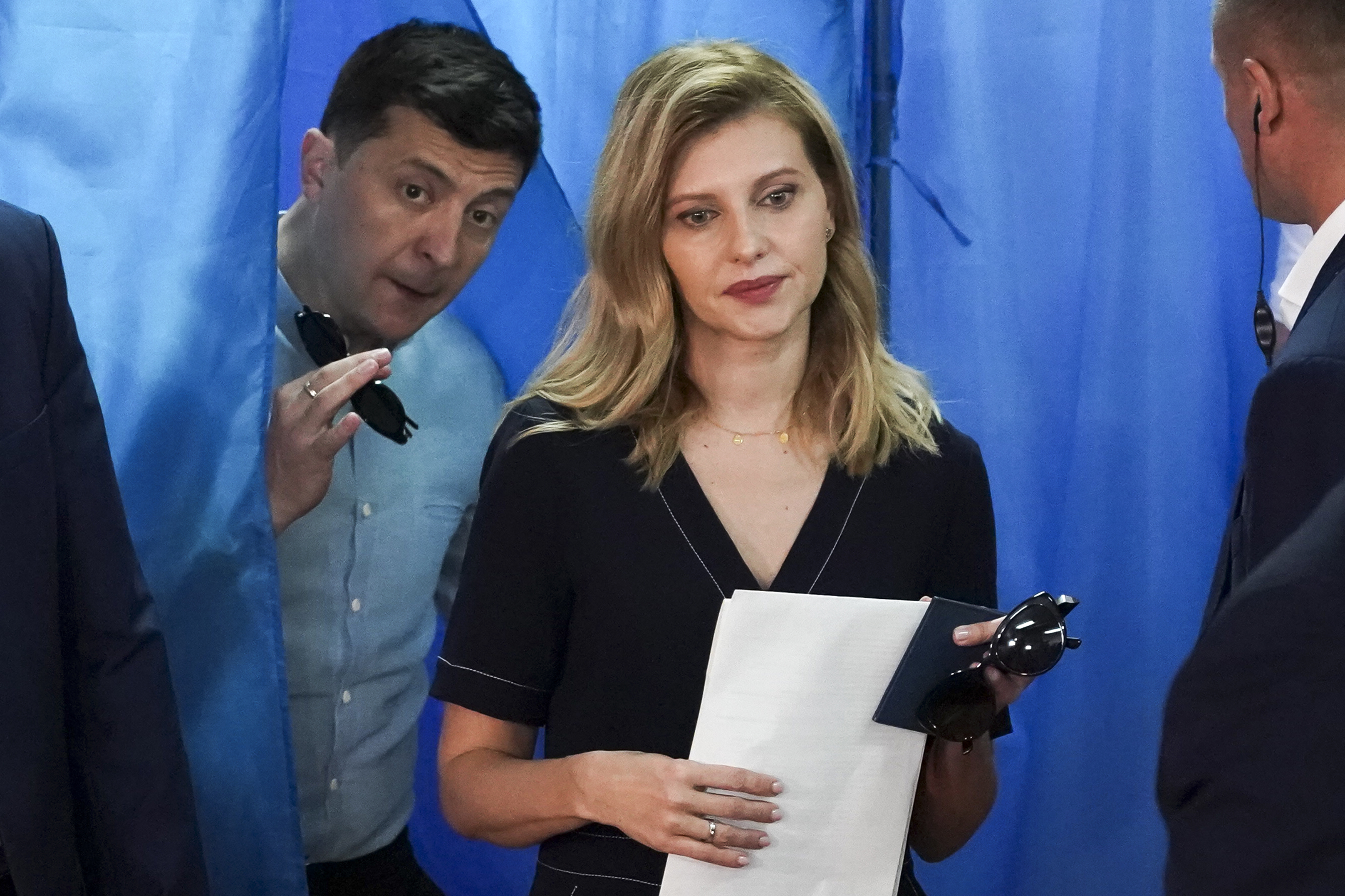 Ukrainian President Volodymyr Zelenskyy, left, and his wife Olena Zelenska leave a booth at a polling station during a parliamentary election in Kiev, Ukraine, July 21, 2019. Ukraine's first lady, Olena Zelenska, says that the war has not changed her husband, but only revealed his qualities, including a determination to prevail, to the world.