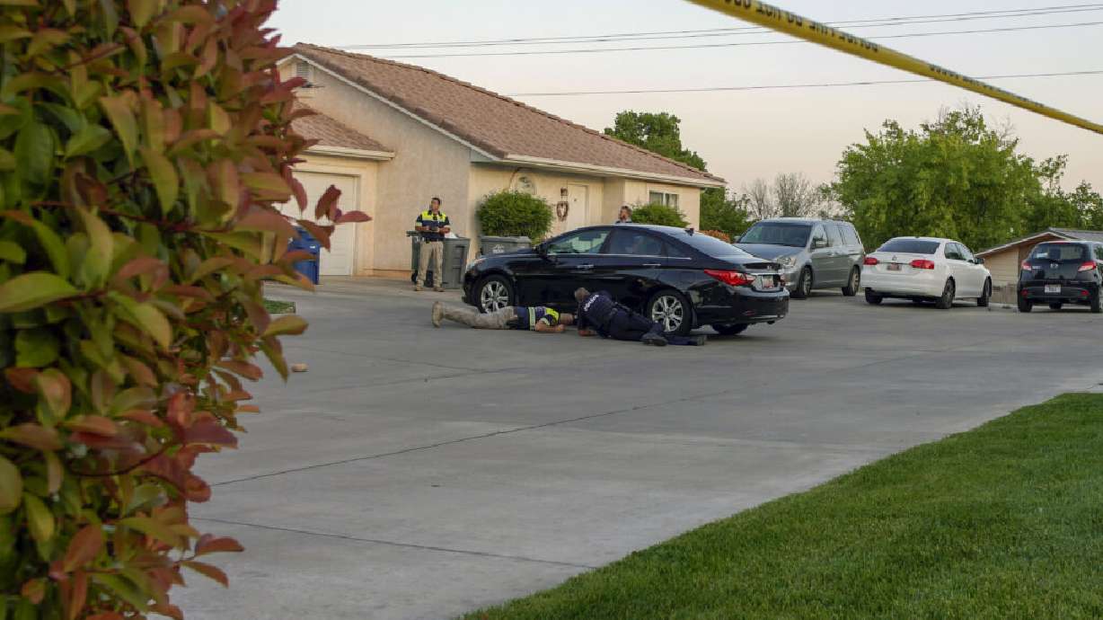 St. George Police Department's accident reconstruction team investigates the scene after a 9-year-old was run over in the driveway of a home on 610 North in St. George, Thursday.