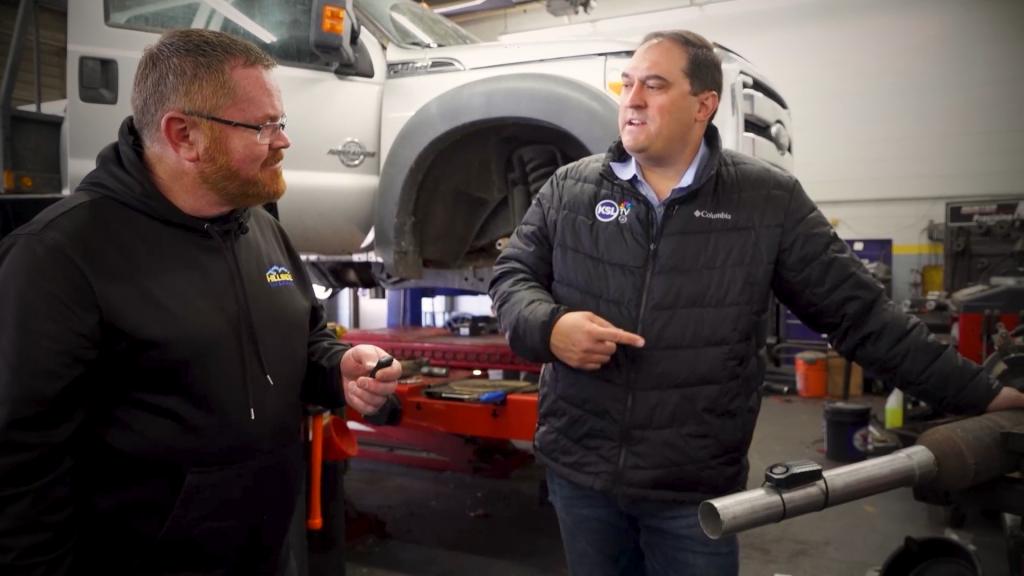 Chris Pappas of Hillside Tire tests out a $30 motion alarm that shrieks loudly if a car’s exhaust system gets jostled, on April 8.