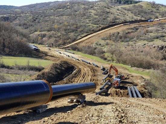 Heavy machines install a pipeline near Komotini town, northern Greece, March 5, 2021. Crossing a remote border area of Greece and Bulgaria, a new pipeline nearing completion will help countries in the region dependent on Russian imports have greater access to the global natural gas market.