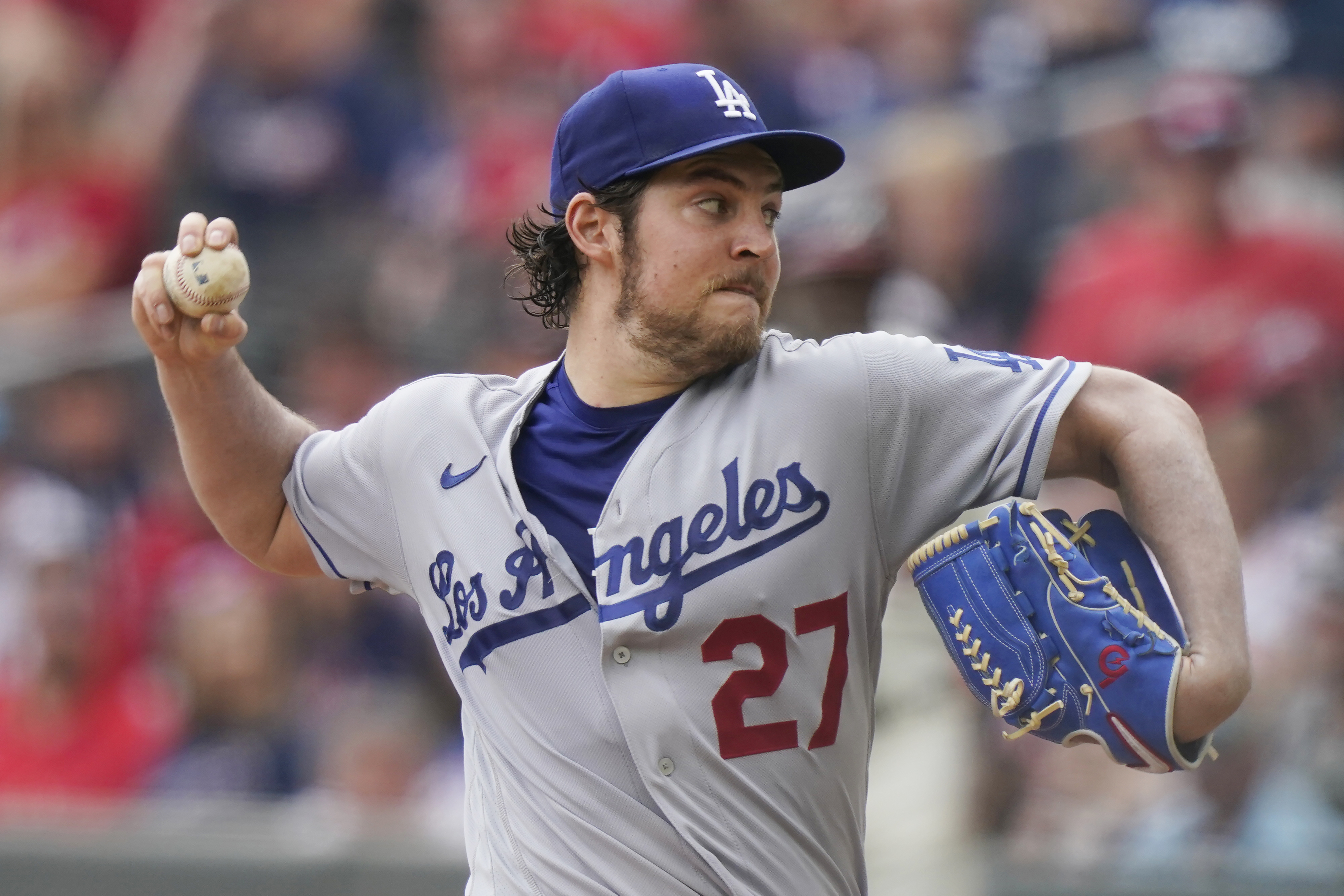 FILE - Los Angeles Dodgers starting pitcher Trevor Bauer delivers in the first inning of a baseball game against the Atlanta Braves, June 6, 2021, in Atlanta. Bauer sued the woman who accused him of sexual assault in federal court Monday, April 25, 2022, in a move that came less than three months after prosecutors decided not to file criminal charges against the athlete. 