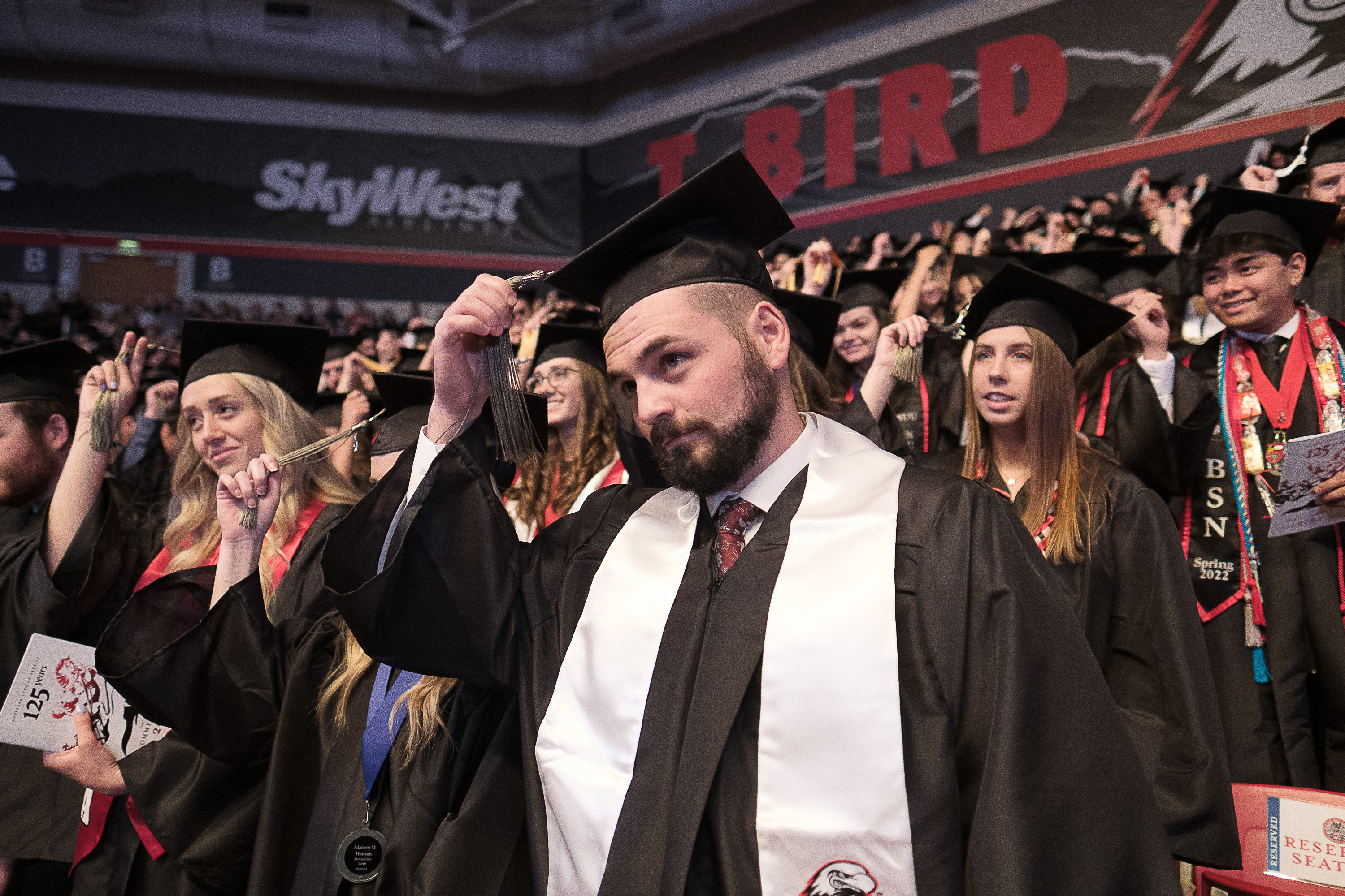 Colton Jensen moves his tassel to the left as graduates are conferred their degrees during the 123rd annual commencement for Southern Utah University in Cedar City on Friday.