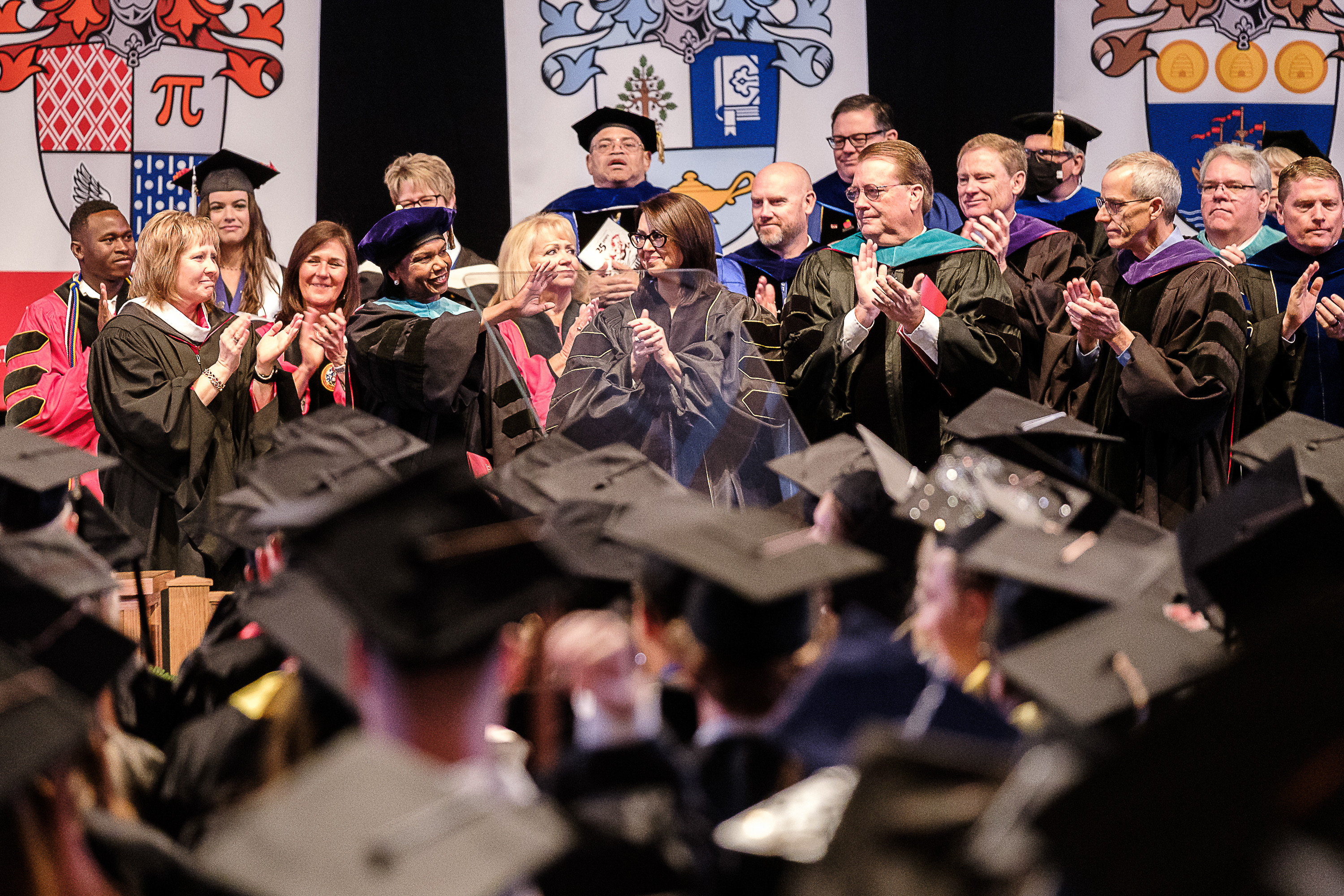 Former U.S. Secretary of State Condoleezza Rice waves as she is applauded following her address to the Class of 2022 at the 123rd annual commencement for Southern Utah University in Cedar City on Friday.