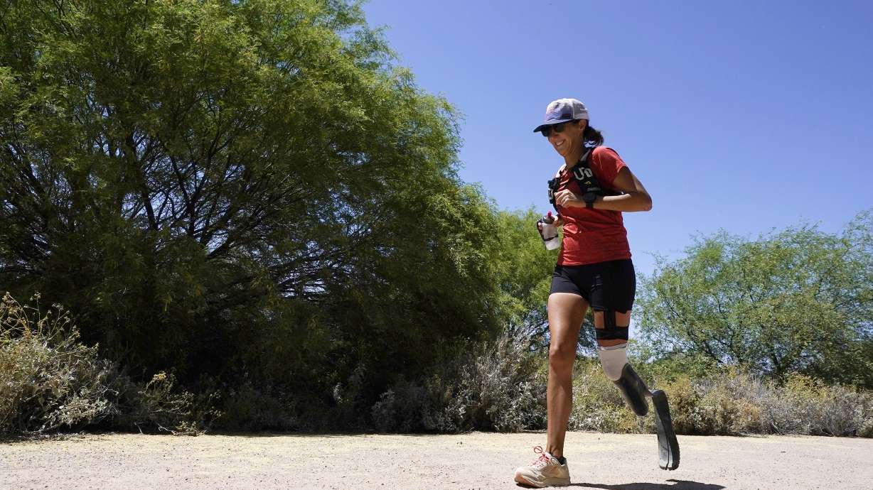 Jacky Hunt-Broersma runs her 102nd marathon in 102 days, this one at Veterans Oasis Park, Thursday, April 28, 2022, in Chandler, Ariz.