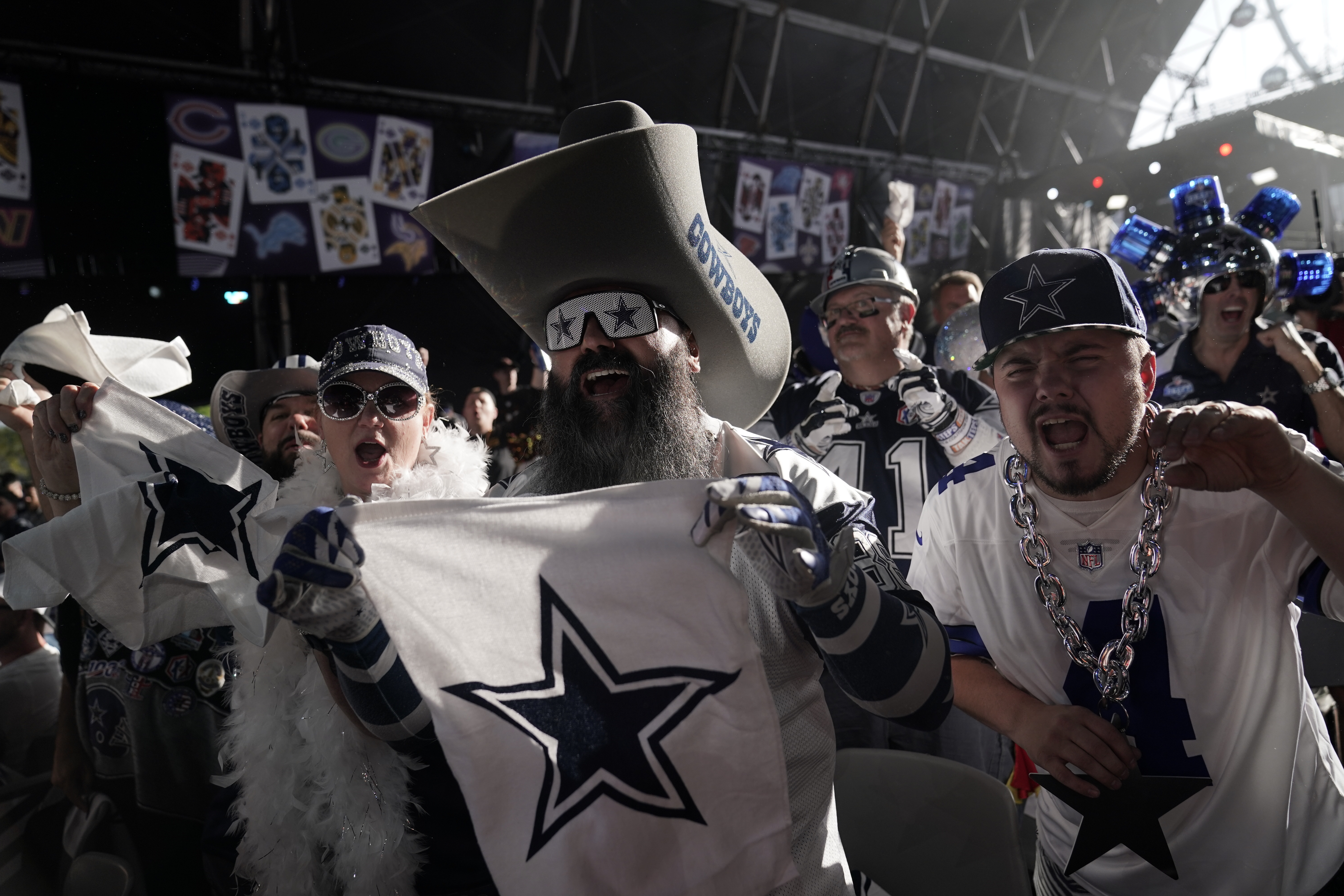 Dallas Cowboys fan cheer during the second round of the NFL football draft Friday, April 29, 2022, in Las Vegas. 