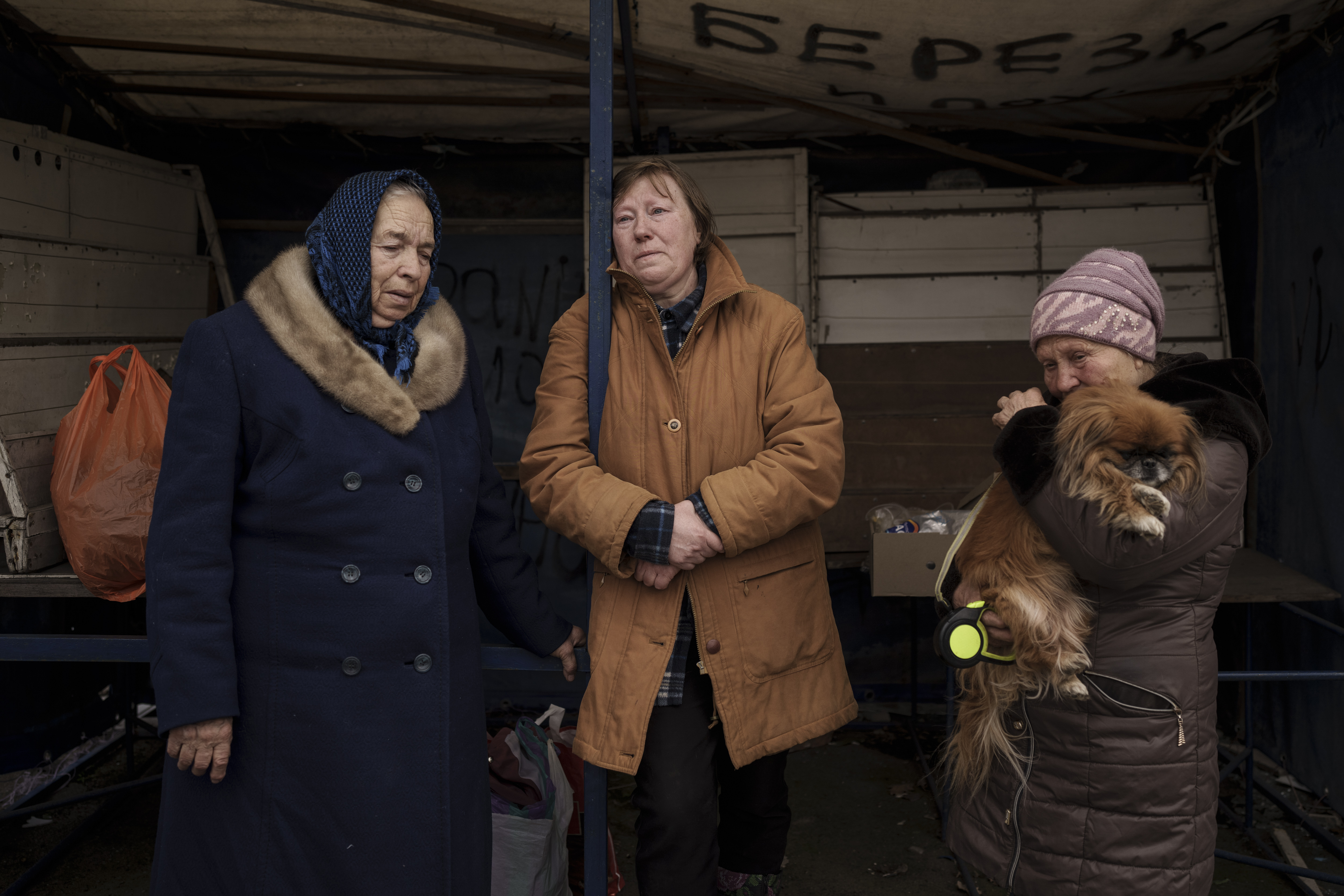 People fleeing the village of Ruska Lozova wait at a screening point in Kharkiv, Ukraine, Friday. Hundreds of residents have been evacuated to Kharkiv from the nearby village that had been under Russian occupation for more than a month.