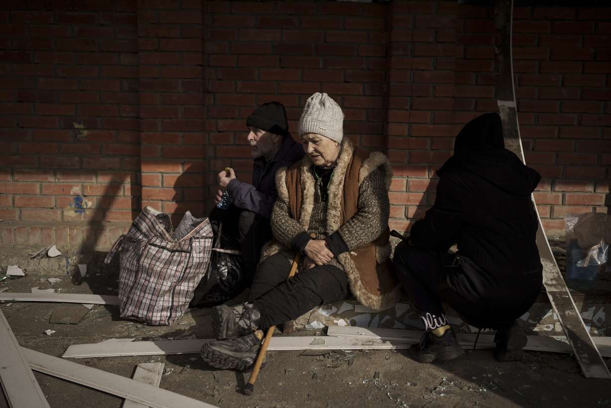 People fleeing the village of Ruska Lozova wait at a screening point in Kharkiv, Ukraine, Friday. Hundreds of residents have been evacuated to Kharkiv from the nearby village that had been under Russian occupation for more than a month.
