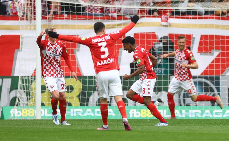 Soccer Football - Bundesliga - 1. FSV Mainz 05 v Bayern Munich - MEWA Arena, Mainz, Germany - April 30, 2022 1.FSV Mainz 05's Leandro Barreiro celebrates scoring their third goal with teammates