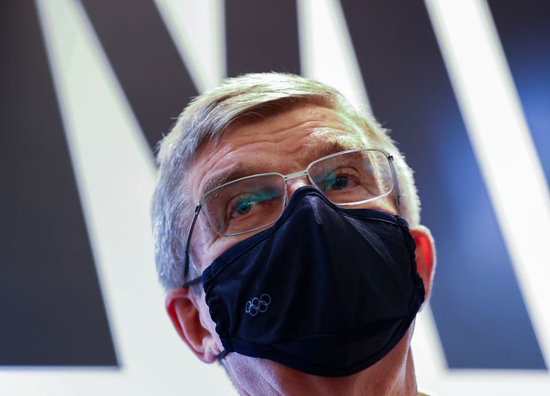 FILE PHOTO: International Olympic Committee (IOC) President Thomas Bach speaks to the media as he visits the Olympic Agora exhibition in Tokyo, Japan, July 30, 2021.
