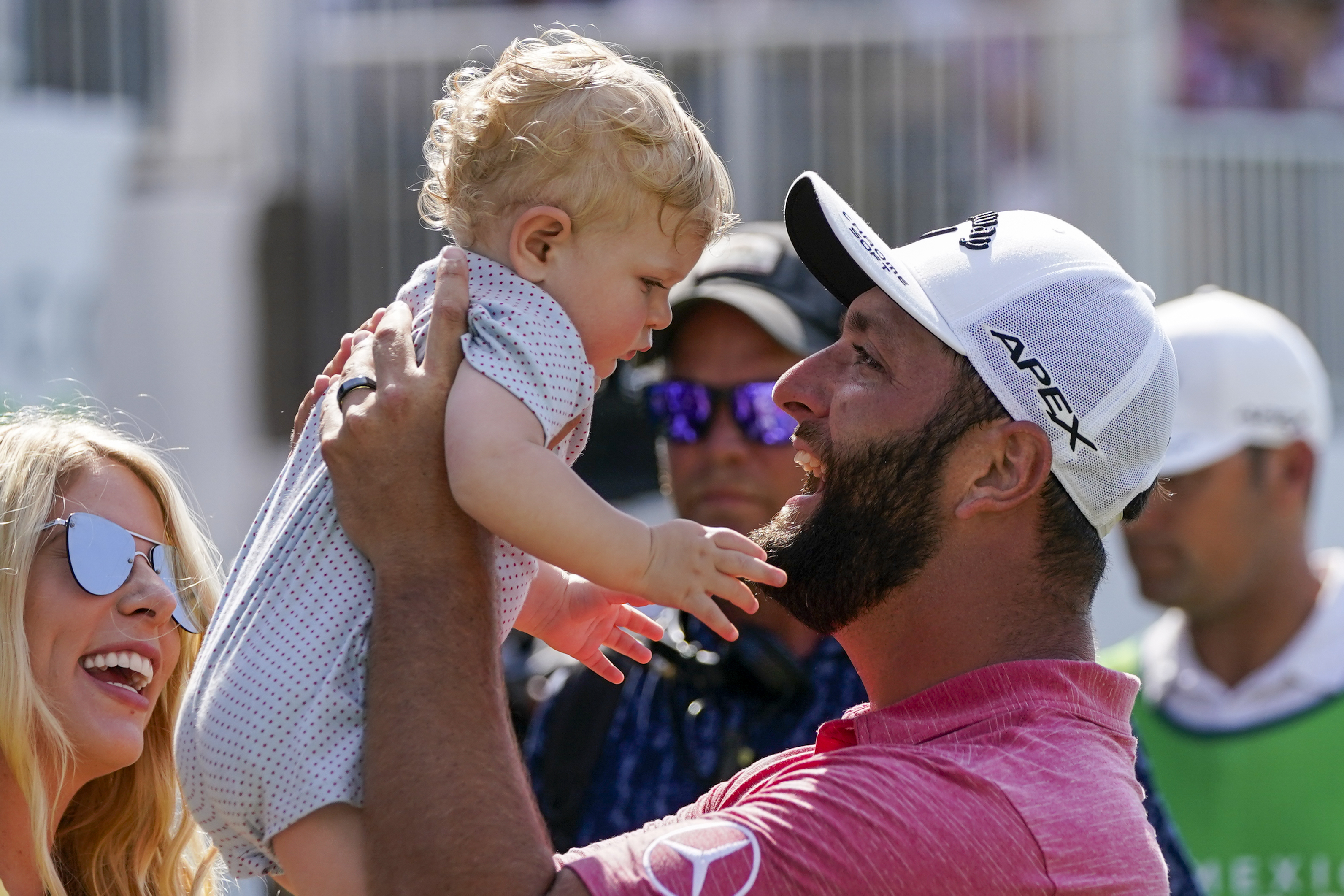 Jon Rahm, of Spain, holds up his son Kepa as he celebrates his victory the Mexico Open at Vidanta, in Puerto Vallarta, Mexico, Sunday, May 1, 2022. 