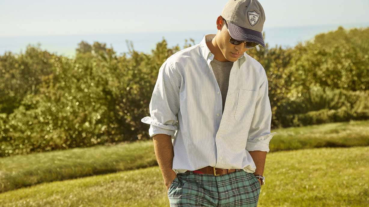 A model shows a Brooks Brothers casual office wardrobe. Going back to the office, many don't want to return to structured looks like suits, zip-front pants and pencil skirts from the pre-pandemic days.