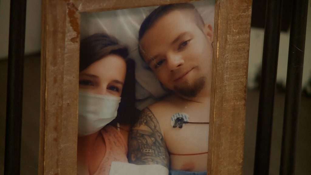 Miles Tolman is pictured with his wife during his hospital treatment for cancer.