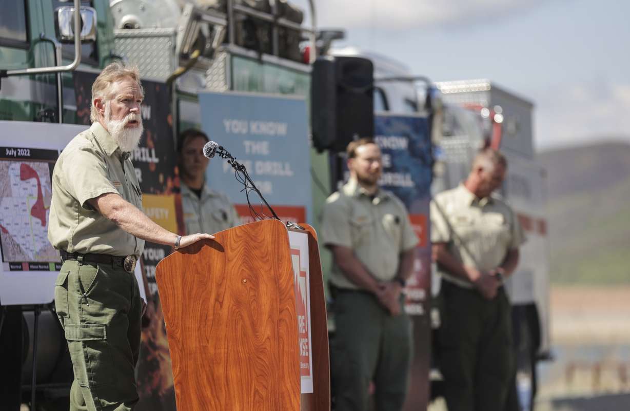 Kevin Greenhalgh, deputy director of Regional Fire and Aviation Management, talks about ways to prevent wildfires during a press conference at Little Dell Reservoir outside of Salt Lake City on Monday.