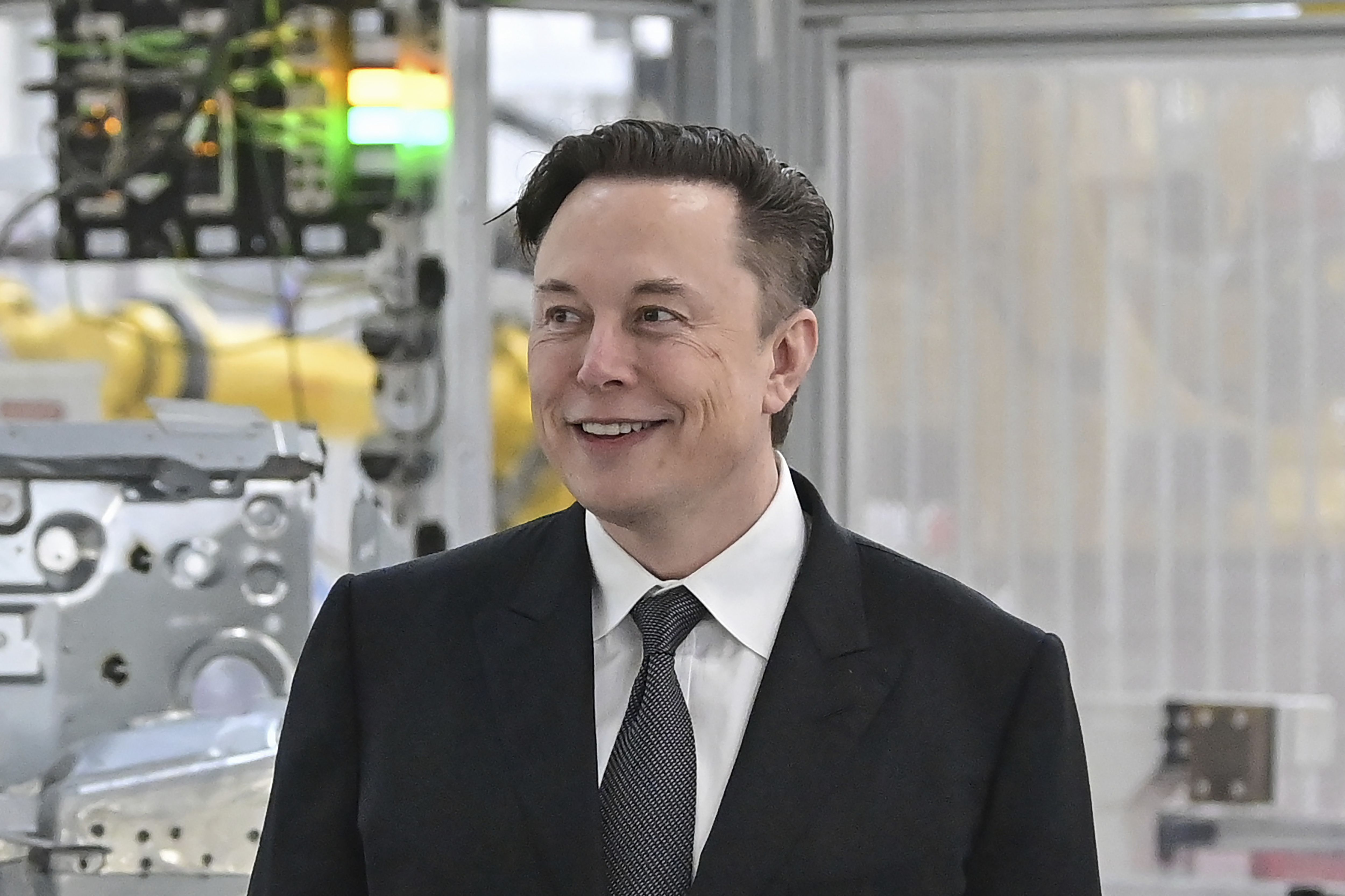 Tesla CEO Elon Musk attends the opening of the Tesla factory Berlin Brandenburg in Gruenheide, Germany, on March 22. Musk promised finance partners he’d slash costs, juice revenues and bring in new leadership to back his $44 billion acquisition of Twitter earlier this month. Now, further details are emerging including reports that Musk is considering staff layoffs when he takes control of the company.