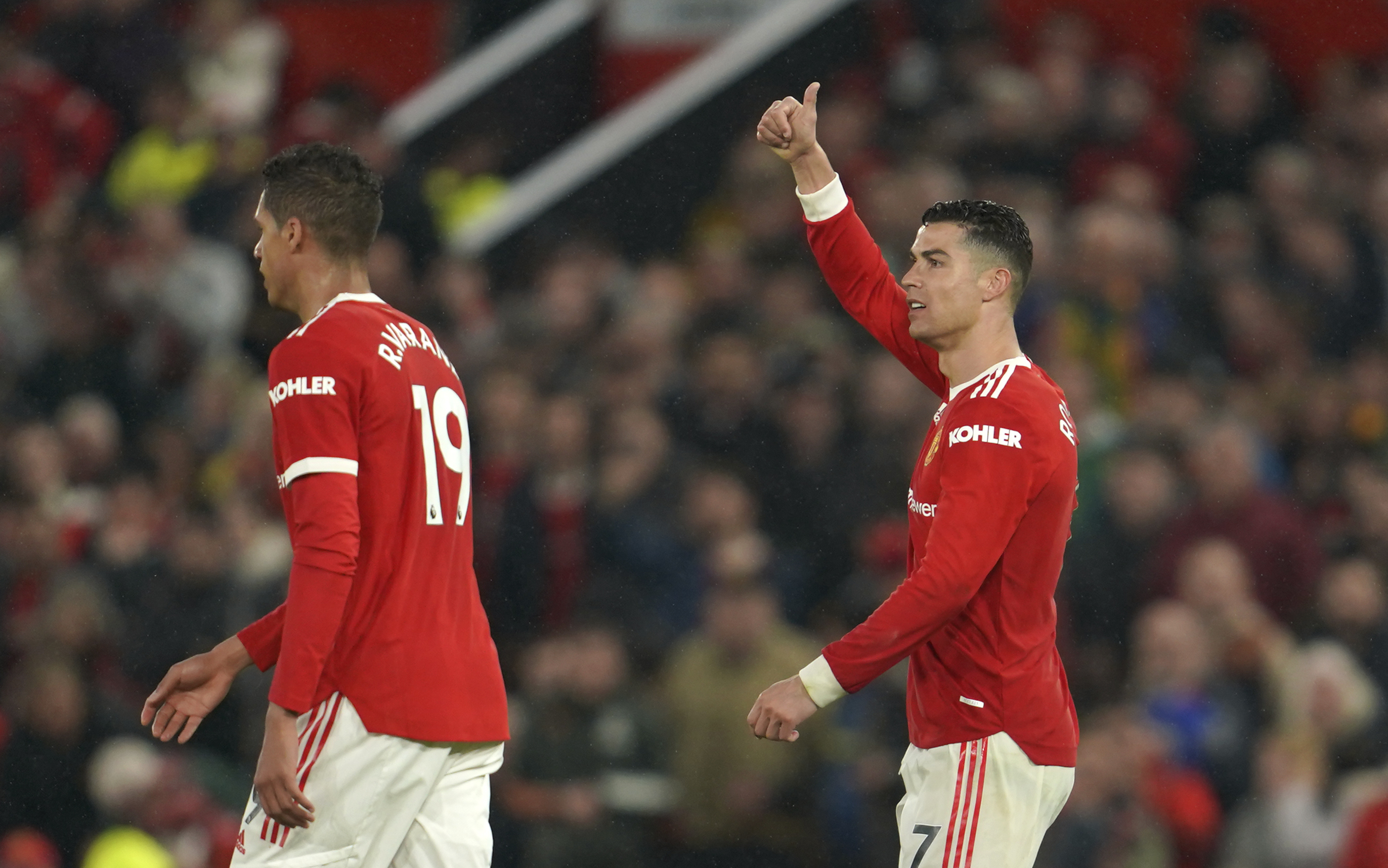 Manchester United's Cristiano Ronaldo, right, reacts during the English Premier League soccer match between Manchester United and Brentford at Old Trafford Stadium in Manchester, England, Monday, May 2, 2022. 