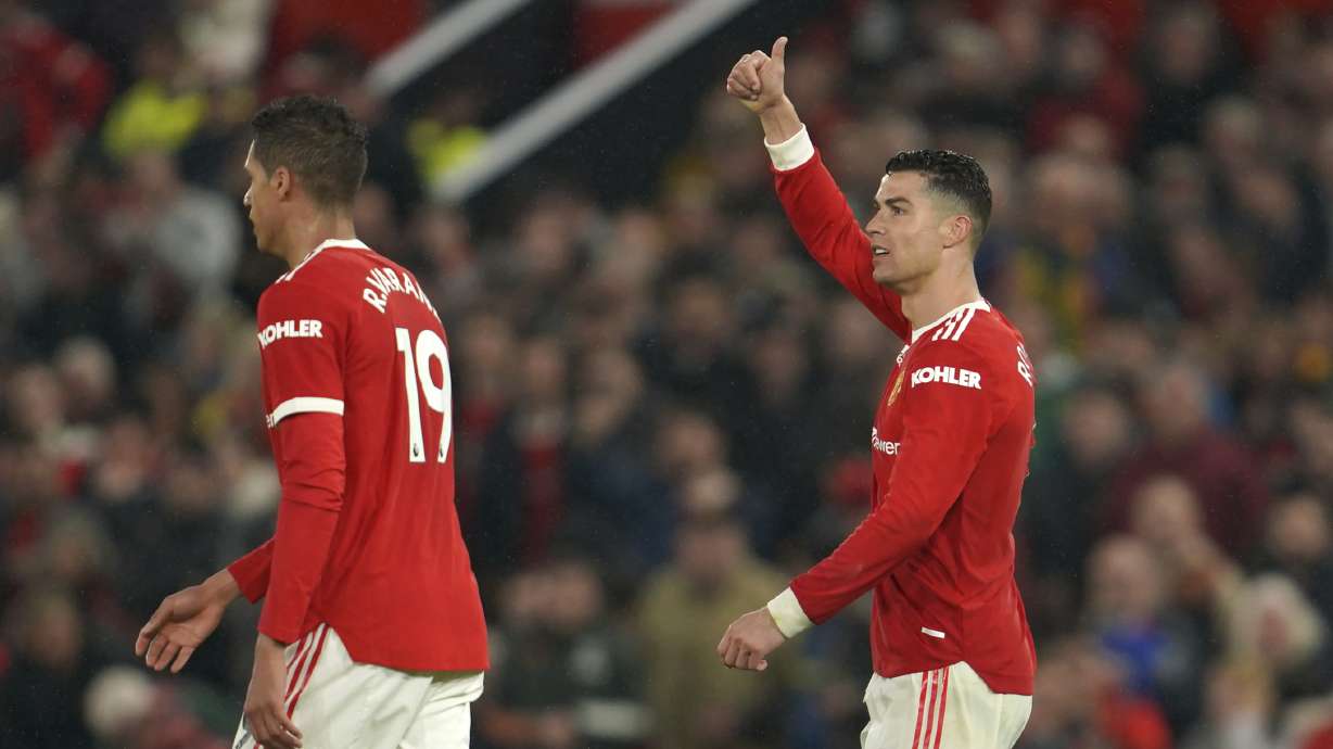 Manchester United's Cristiano Ronaldo, right, reacts during the English Premier League soccer match between Manchester United and Brentford at Old Trafford Stadium in Manchester, England, Monday, May 2, 2022.