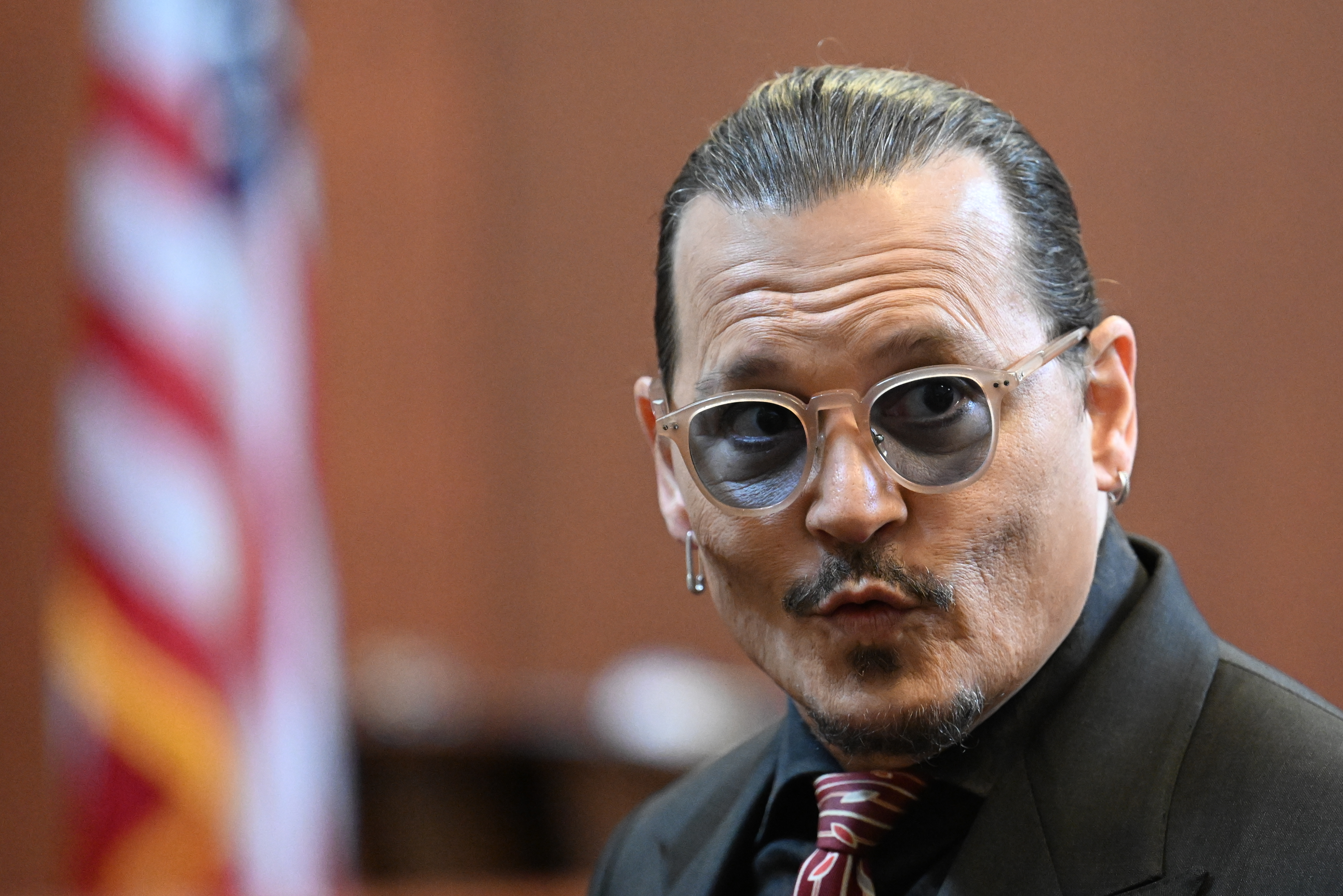 Actor Johnny Depp arrives in the courtroom at the Fairfax County Circuit Court in Fairfax, Va., Tuesday. Depp sued his ex-wife Amber Heard for libel after she wrote an op-ed piece in The Washington Post in 2018 referring to herself as a "public figure representing domestic abuse." 