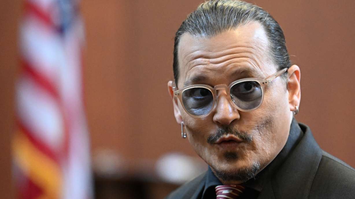 Actor Johnny Depp arrives in the courtroom at the Fairfax County Circuit Court in Fairfax, Va., Tuesday. Depp sued his ex-wife Amber Heard for libel after she wrote an op-ed piece in The Washington Post in 2018 referring to herself as a "public figure representing domestic abuse."