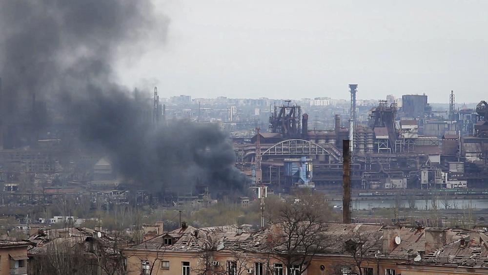 In this photo taken from video smoke rises from the Metallurgical Combine Azovstal in Mariupol, in territory under the government of the Donetsk People's Republic, eastern Ukraine, Tuesday.