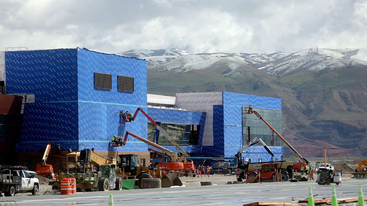 Construction crews build Concourse A East at the new Salt Lake City International Airport in Salt Lake City, on Tuesday. The concourse is projected to have four gates open in the spring of 2023 and 18 gates open in the fall of 2023.