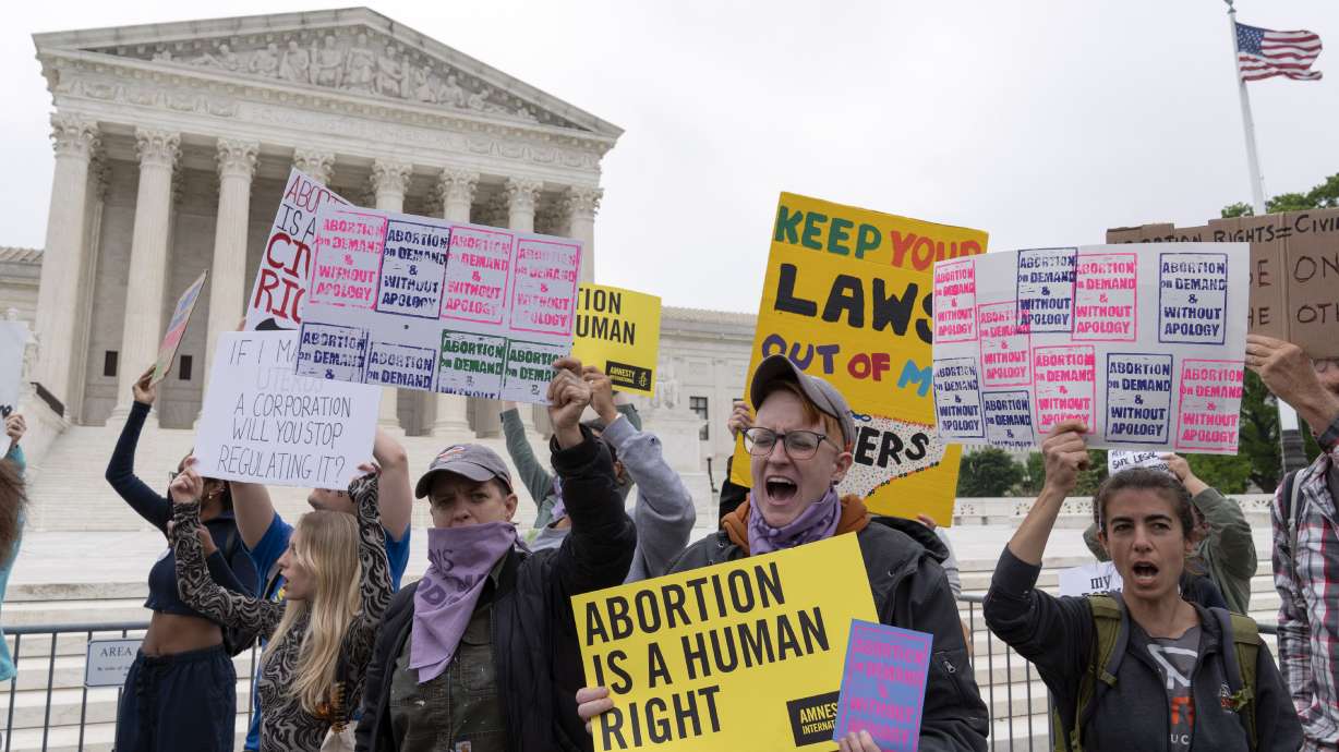 Demonstrators protest outside of the U.S. Supreme Court Tuesday, May 3, 2022 in Washington. A draft opinion suggests the U.S. Supreme Court could be poised to overturn the landmark 1973 Roe v. Wade case that legalized abortion nationwide, according to a Politico report released Monday. Whatever the outcome, the Politico report represents an extremely rare breach of the court's secretive deliberation process, and on a case of surpassing importance.