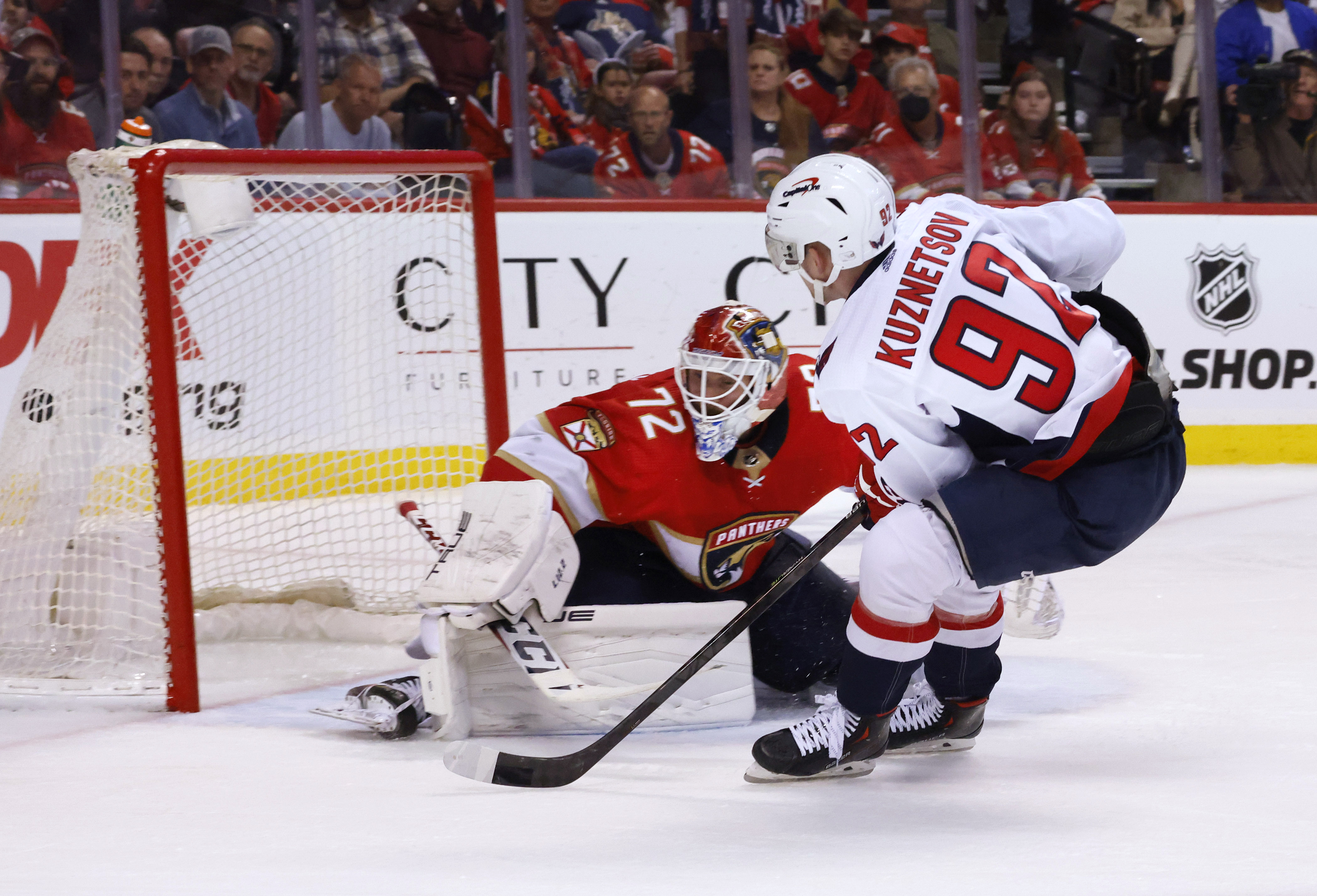 Washington Capitals center Evgeny Kuznetsov (92) scores against Florida Panthers goaltender Sergei Bobrovsky (72) during the third period of Game 1 of an NHL hockey first-round playoff series Tuesday, May 3, 2022, in Sunrise, Fla. 