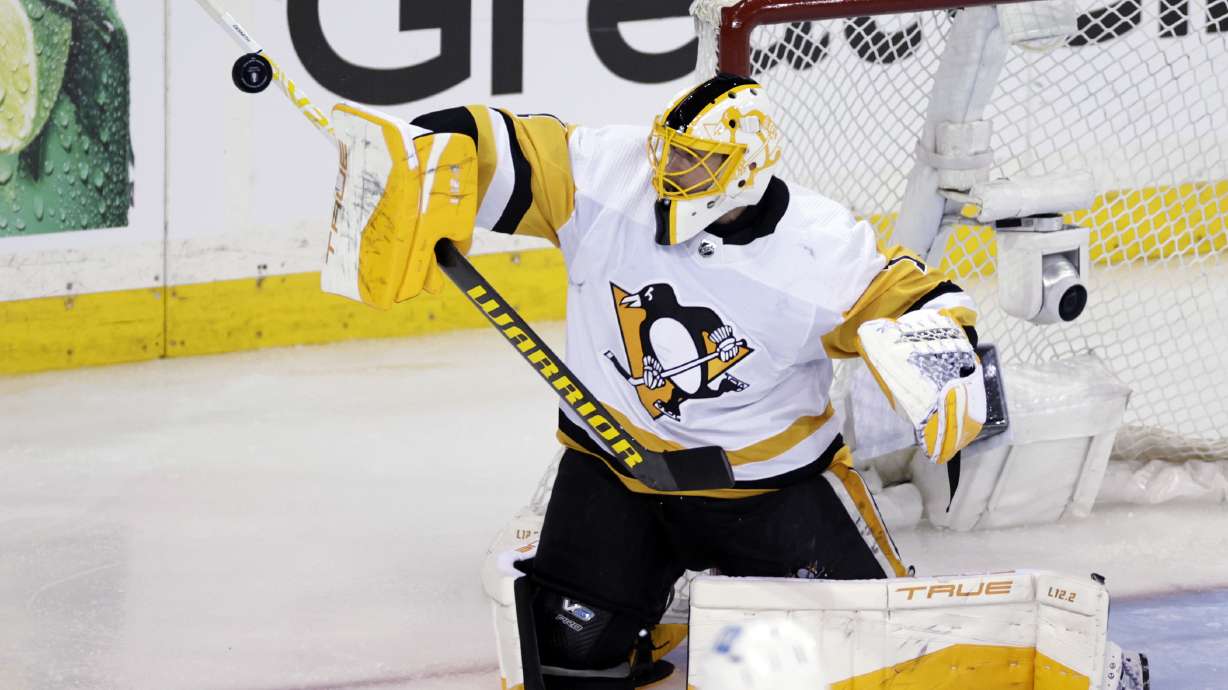 Pittsburgh Penguins goaltender Casey DeSmith makes a save against the New York Rangers in overtime of Game 1 of an NHL hockey Stanley Cup first-round playoff series, Tuesday, May 3, 2022, in New York.