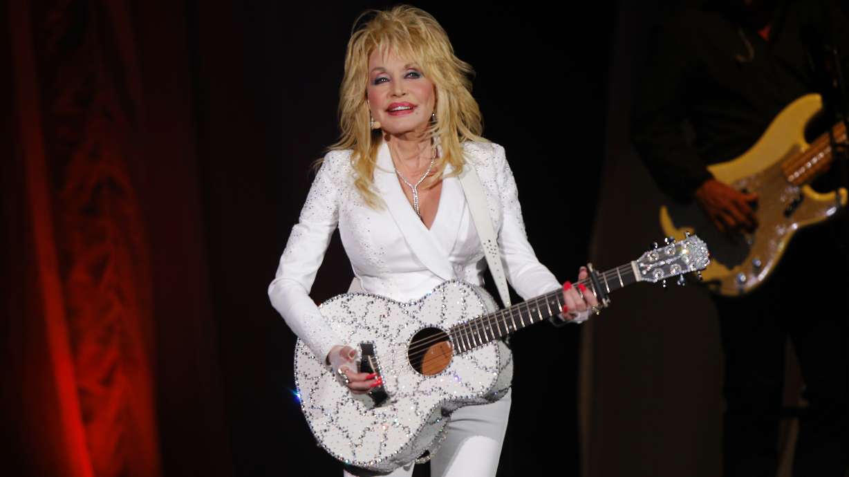 Dolly Parton performs in concert on July 31, 2015, in Nashville, Tenn. Parton has been inducted into the Rock & Roll Hall of Fame. Eminem, Lionel Richie, Carly Simon, Eurythmics, Duran Duran and Pat Benatar have also been inducted into the Hall.